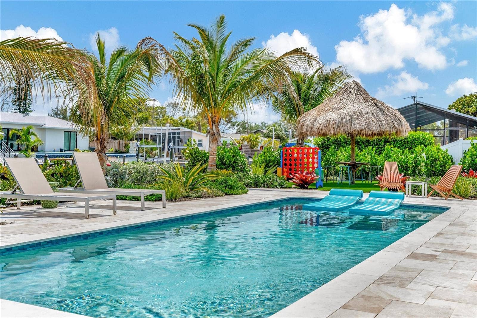 10115 KINGFISHER ROAD E, Bradenton, FL 34209 Approximately 90 feet of waterfront, updated seawall, composite dock, floating kayak/paddleboard dock, and covered 10,000-lb remote boat lift.