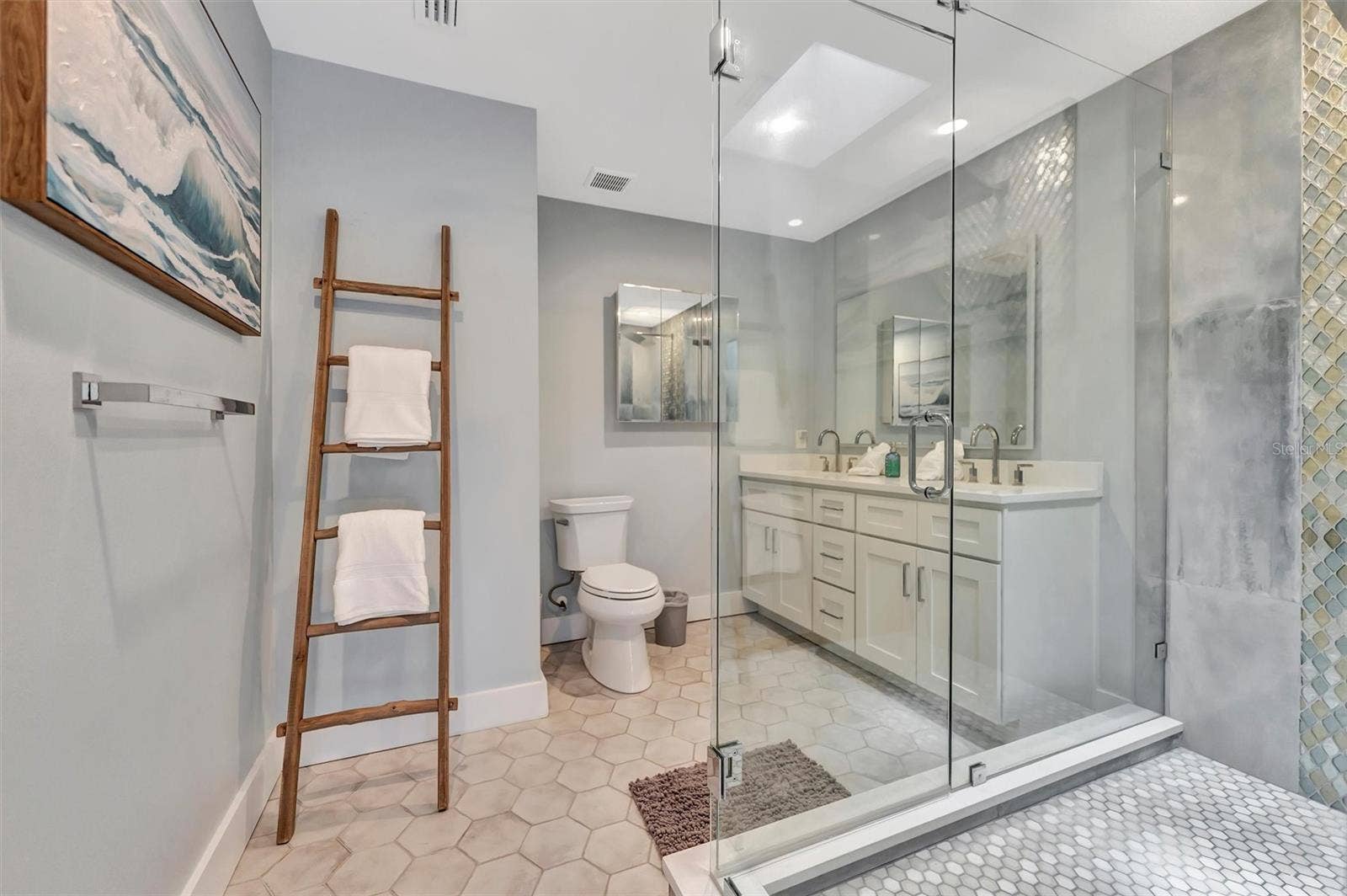10115 KINGFISHER ROAD E, Bradenton, FL 34209 Spacious primary ensuite with double vanity and walk-in rain shower.