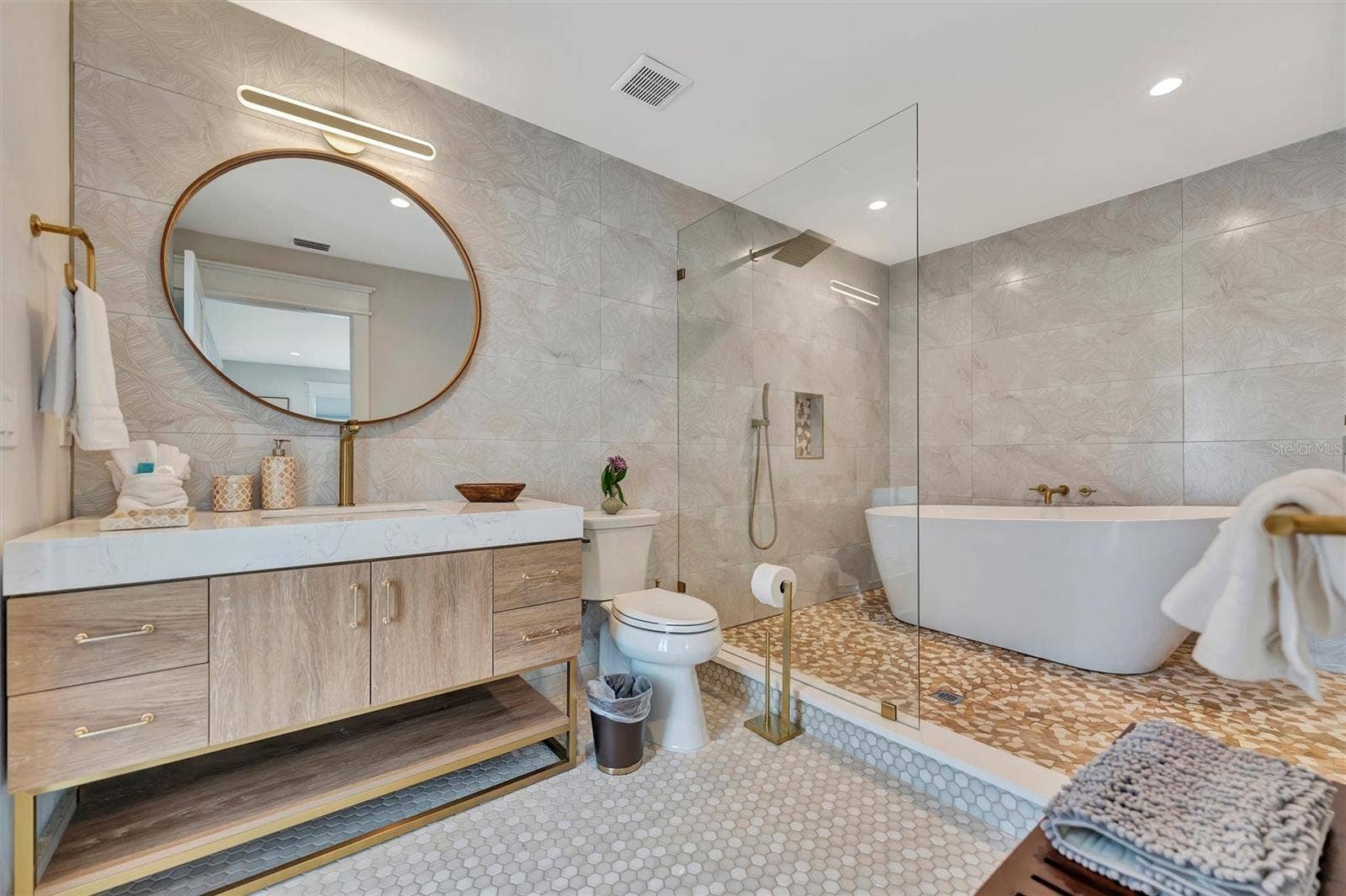 10115 KINGFISHER ROAD E, Bradenton, FL 34209 Updated bathroom with freestanding tub and separate shower.
