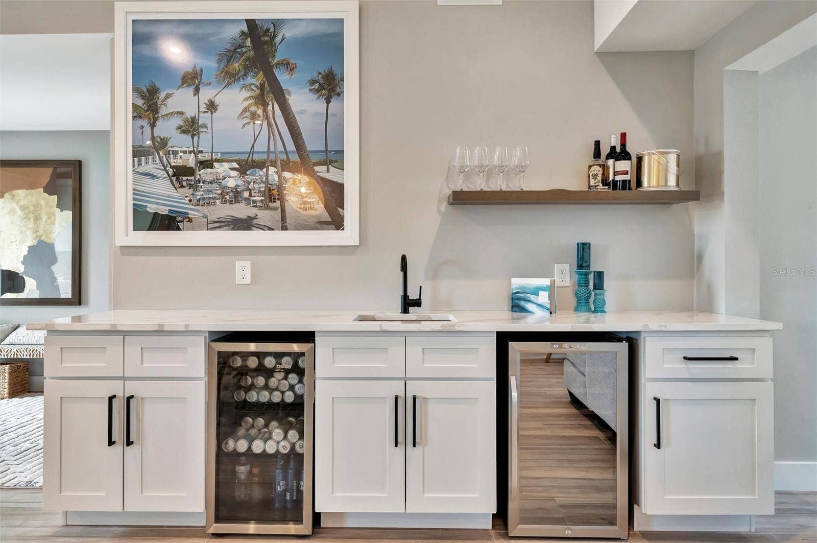 10115 KINGFISHER ROAD E, Bradenton, FL 34209 Chef-inspired kitchen with quality appliances, wine and beverage refrigerators, and wet bar.