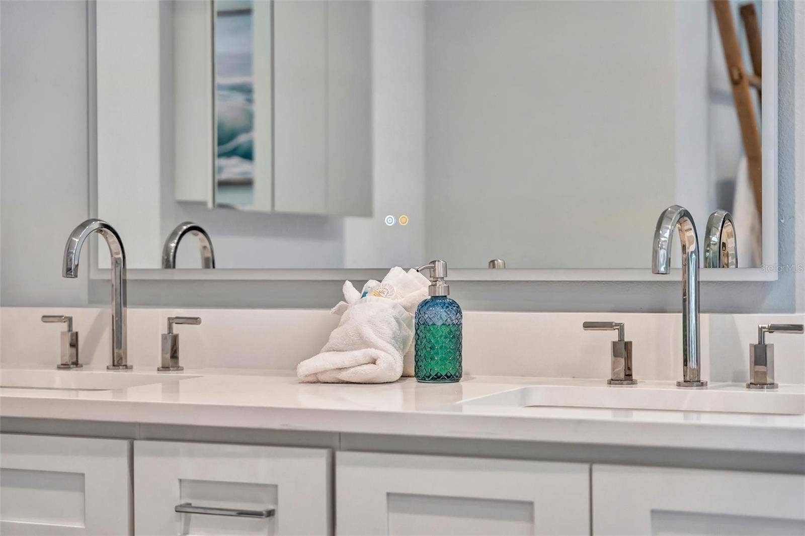 10115 KINGFISHER ROAD E, Bradenton, FL 34209 Spacious primary ensuite with double vanity and walk-in rain shower.
