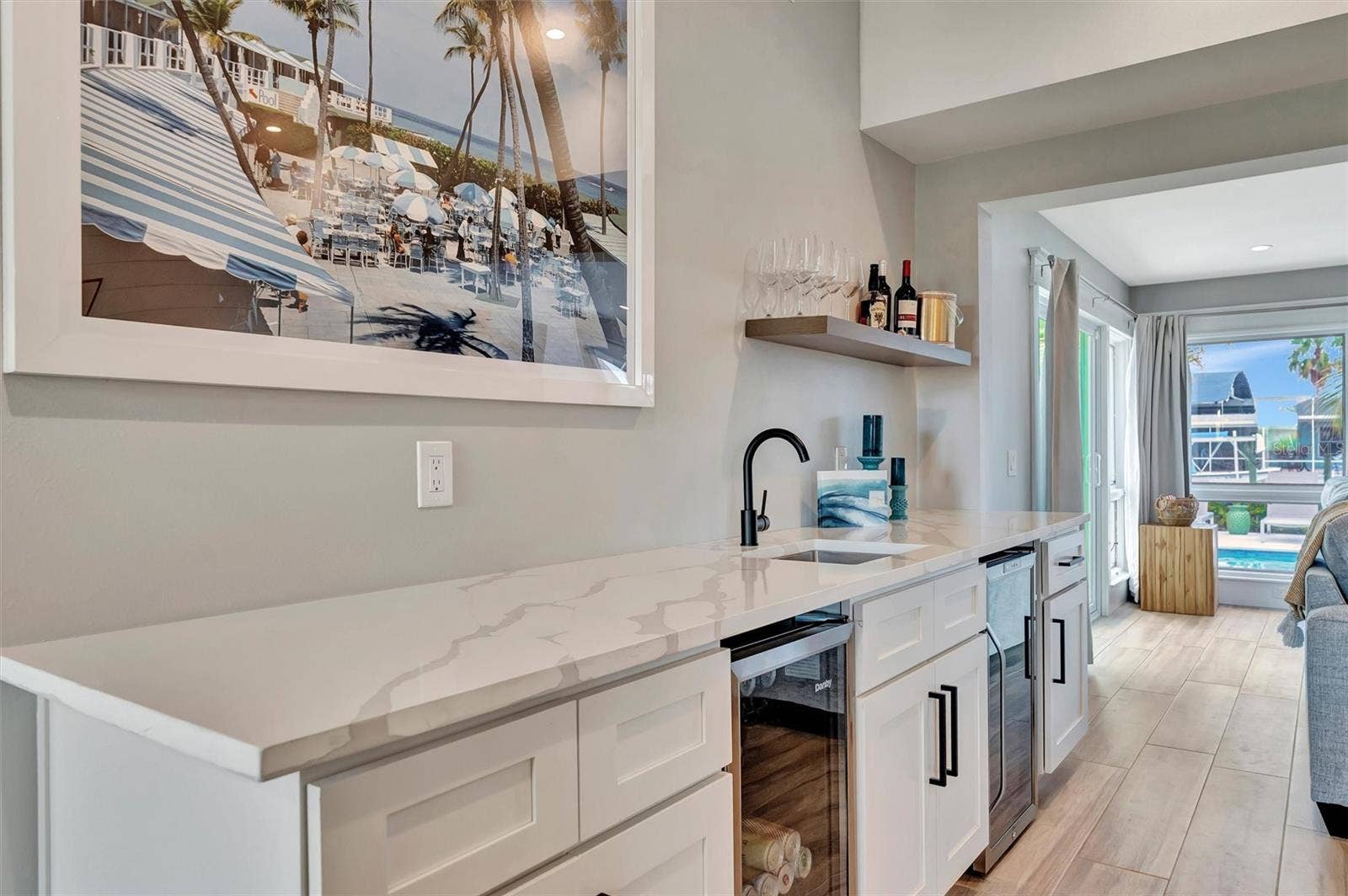 10115 KINGFISHER ROAD E, Bradenton, FL 34209 Chef-inspired kitchen with quality appliances, wine and beverage refrigerators, and wet bar.