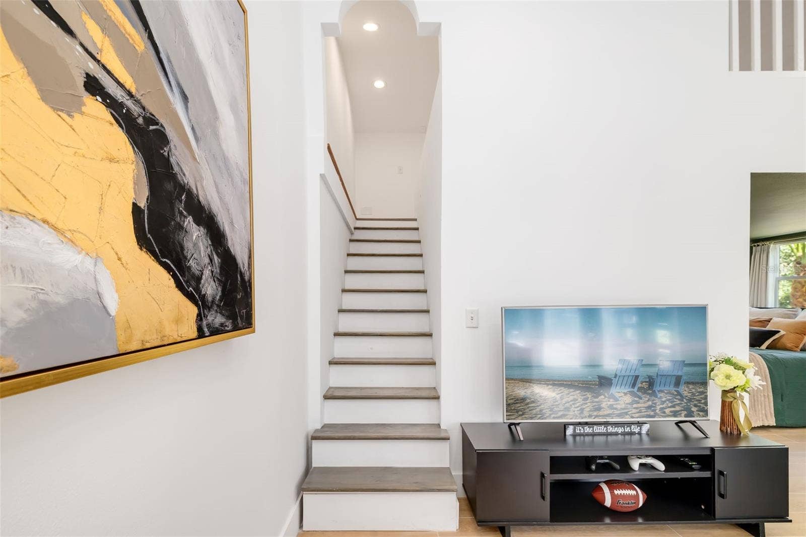 403 LONGBOW TRAIL, Osprey, FL 34229 Additional living area and staircase leading to the loft/flex spacepart of a highly adaptable portion of the home ideal for guests, extended family or multigenerational living.