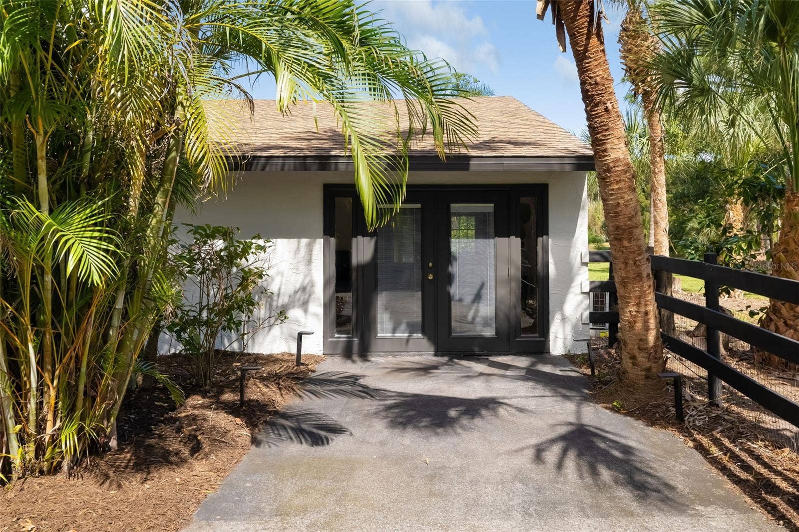 403 LONGBOW TRAIL, Osprey, FL 34229 A private exterior entrance enhances the versatility of this additional bedroom, bath and living areawell suited for guests, extended family, an in-law-style retreat, office or multigenerational living.