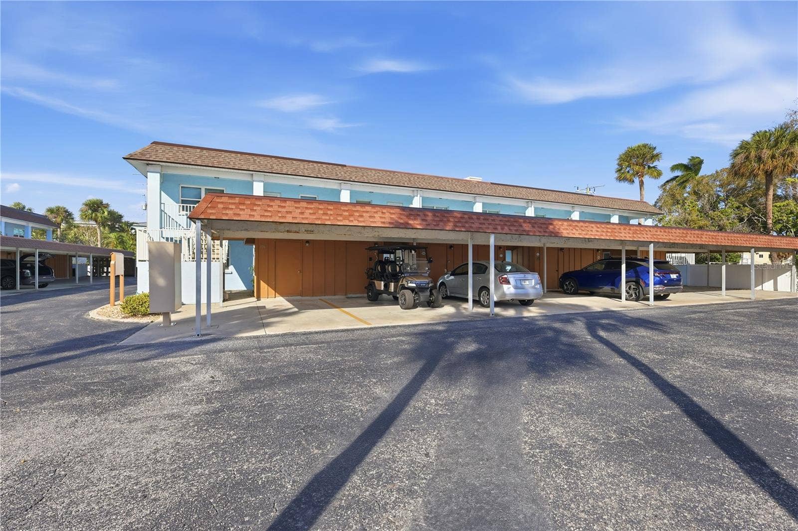4307 GULF DRIVE, #206, Holmes Beach, FL 34217 Assigned parking space with storage area.