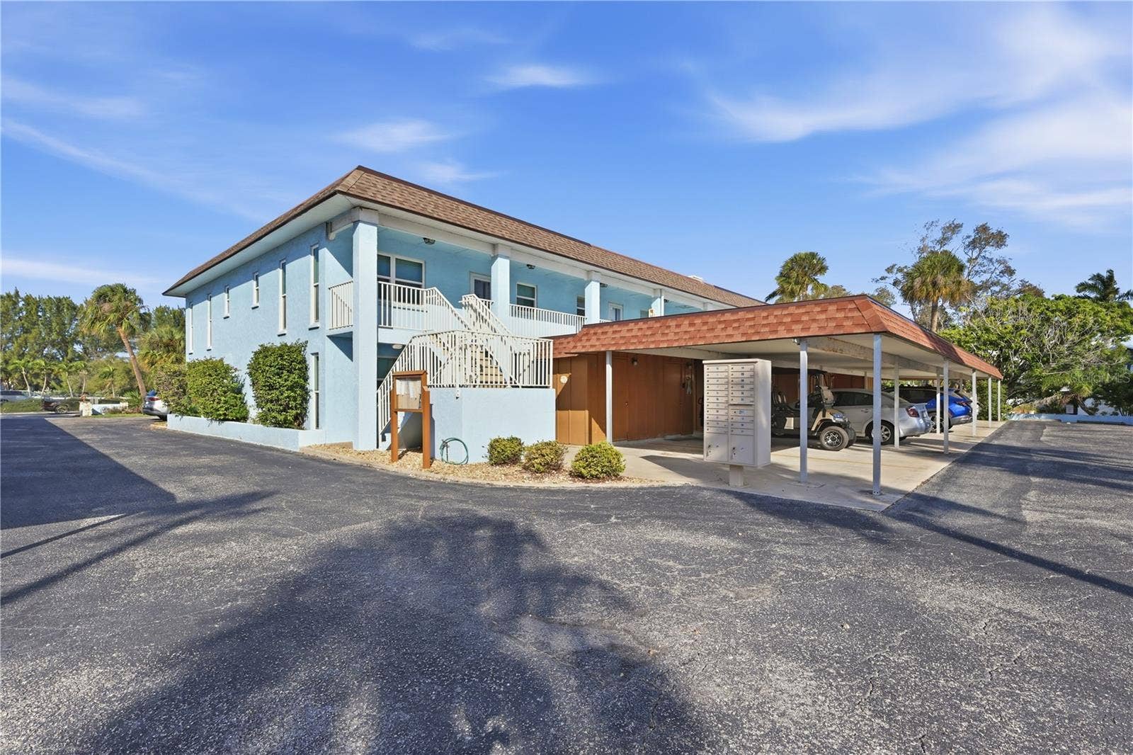 4307 GULF DRIVE, #206, Holmes Beach, FL 34217 Steps up to front door, end unit.