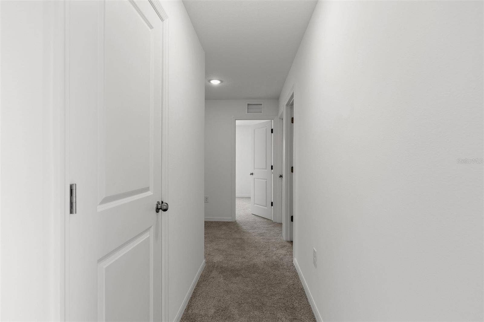 13009 RED DEER PL, Parrish, FL 34219 Hallway to guest bedrooms and laundry room