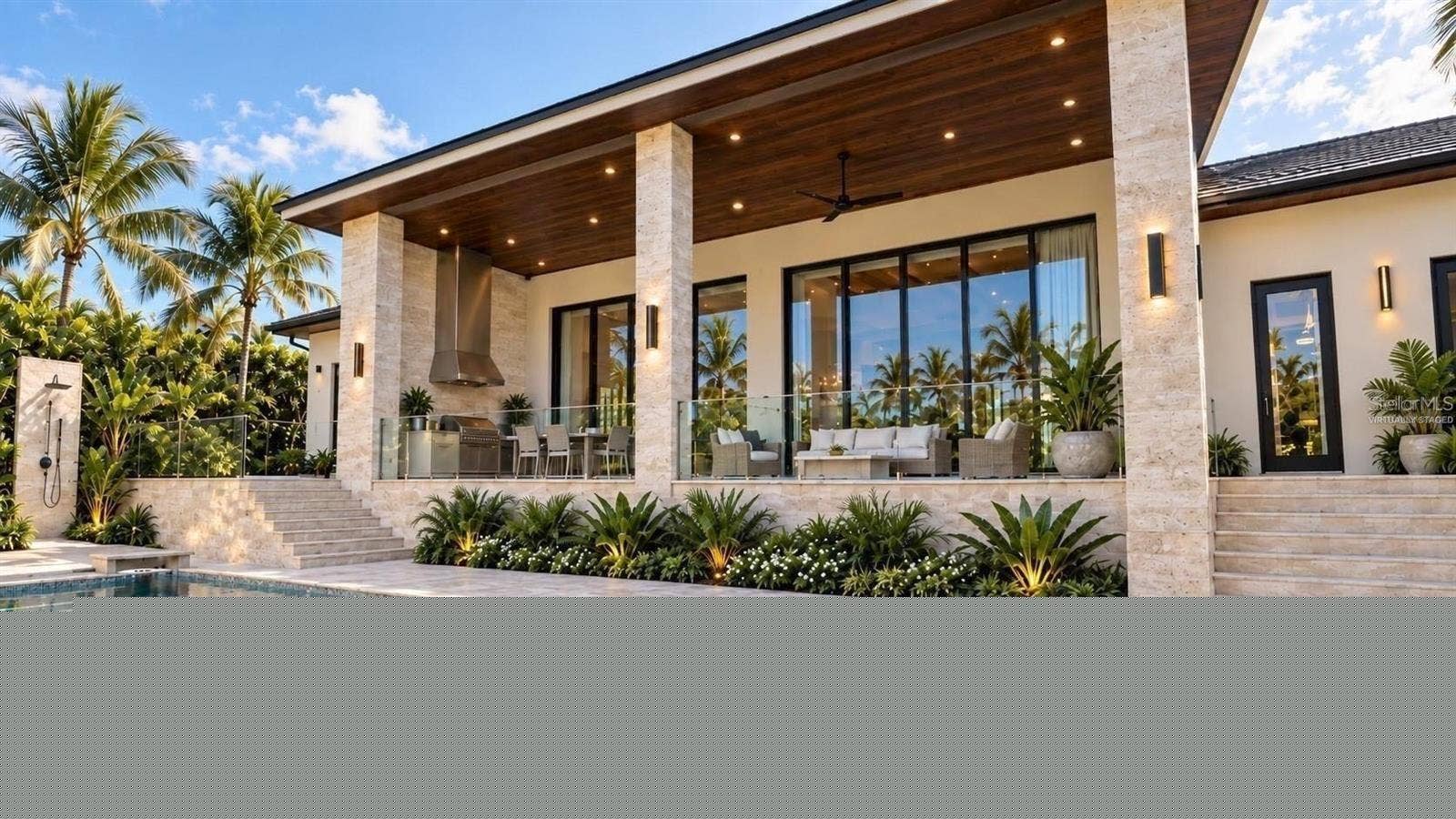 3441 GULFMEAD DRIVE, Sarasota, FL 34242 Patio with full outdoor kitchen, heated saltwater pool and hot tub spa. Virtually staged.