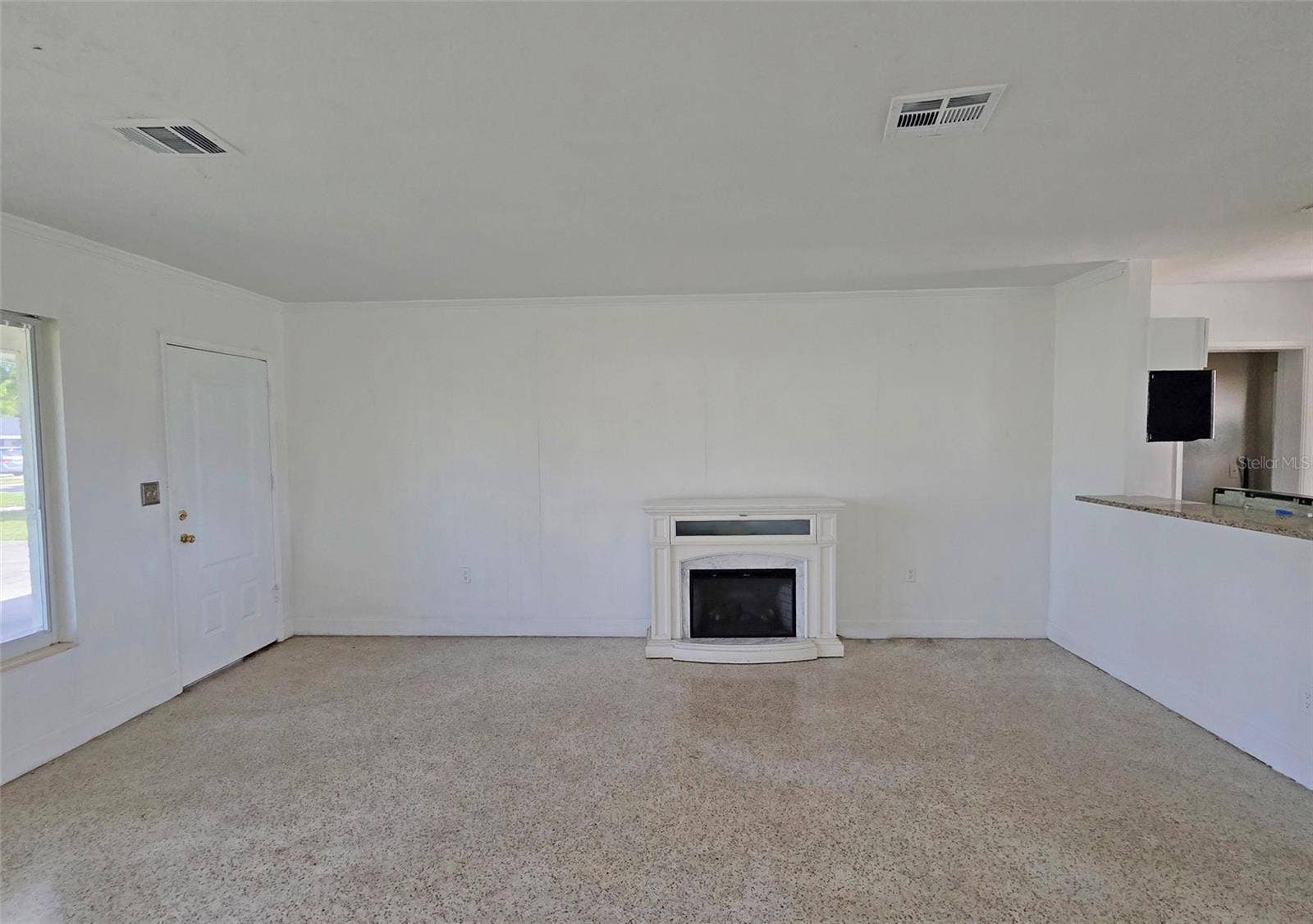 714 MAGELLAN DRIVE, Sarasota, FL 34243 Main living area 3 and fireplace