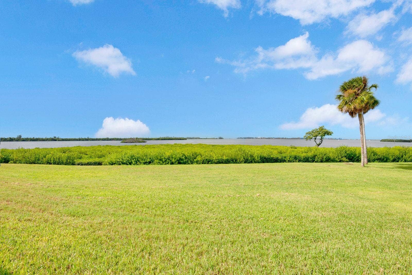 4745 INDEPENDENCE DRIVE, #4745, Bradenton, FL 34210 Sunshine, green grass and water view by the bay