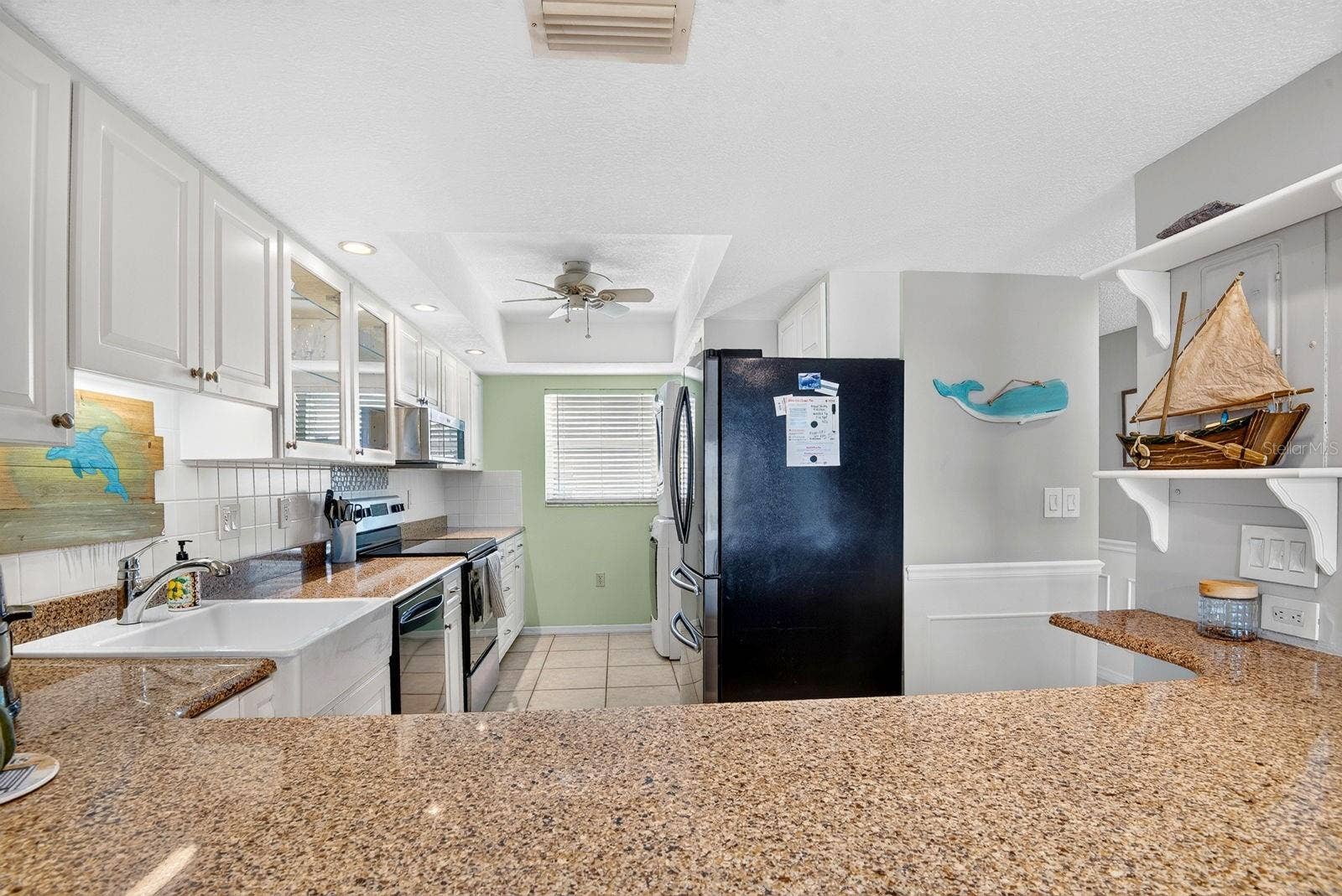 4745 INDEPENDENCE DRIVE, #4745, Bradenton, FL 34210 Facing into kitchen from dining area