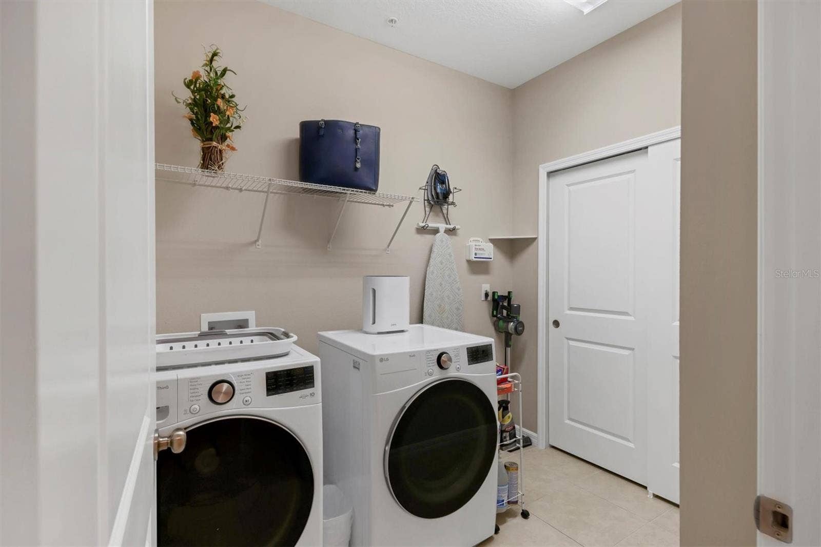 13719 MESSINA LOOP, #202, Lakewood Ranch, FL 34211 Laundry room with HVAC and water heater coset