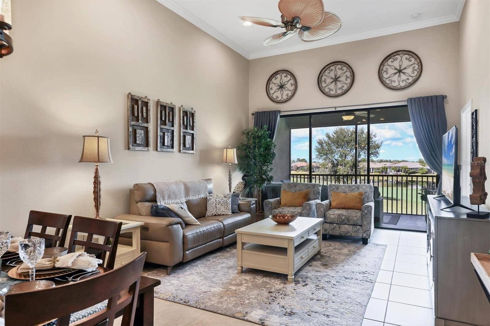 13719 MESSINA LOOP, #202, Lakewood Ranch, FL 34211 Living room with vaulted ceiling, and large sliders to a Gorgeous View!