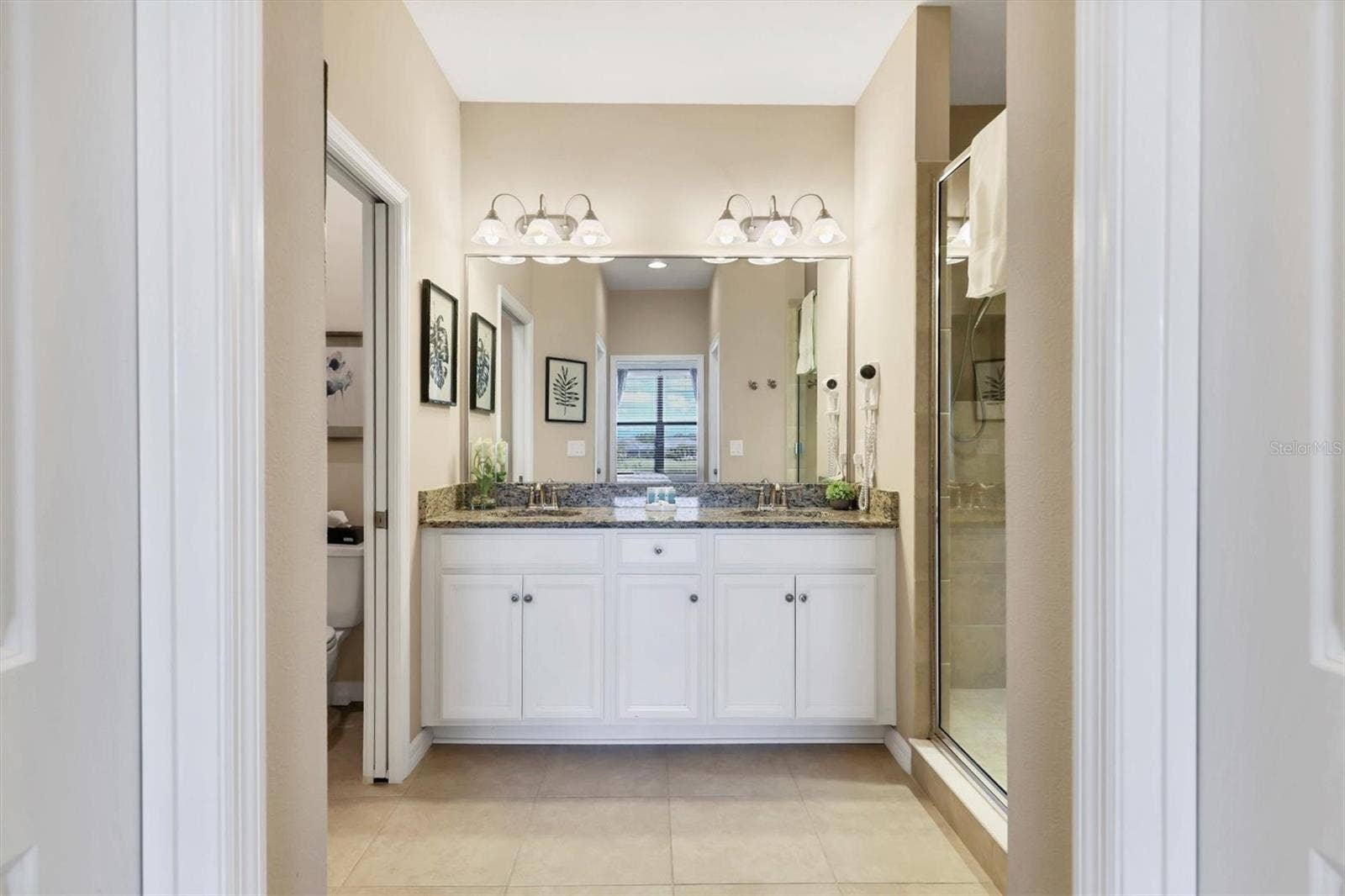 13719 MESSINA LOOP, #202, Lakewood Ranch, FL 34211 Primary bathroom with dual sinks and largeshower