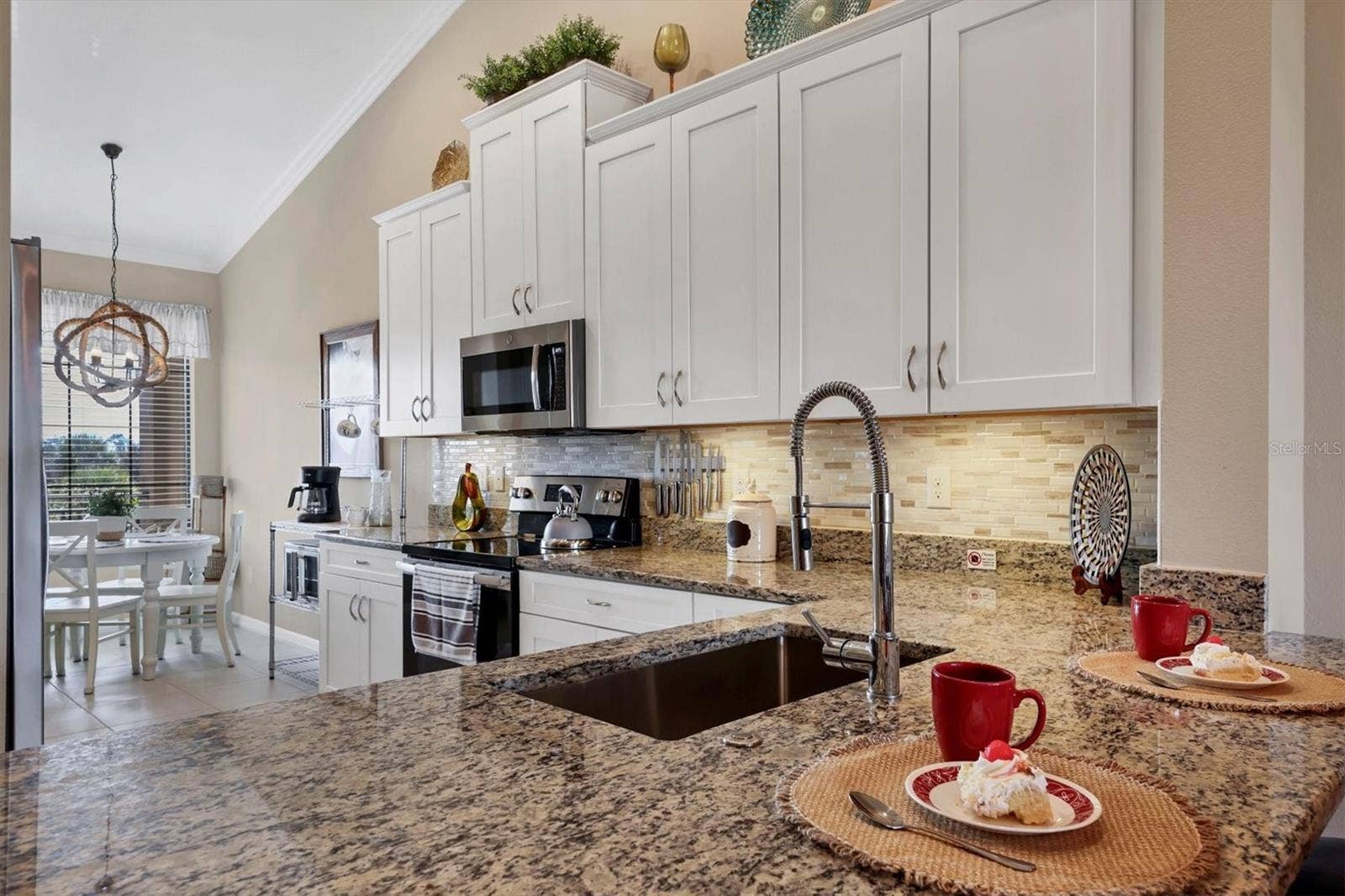 13719 MESSINA LOOP, #202, Lakewood Ranch, FL 34211 Granite Counters and tall wooden cabinetry