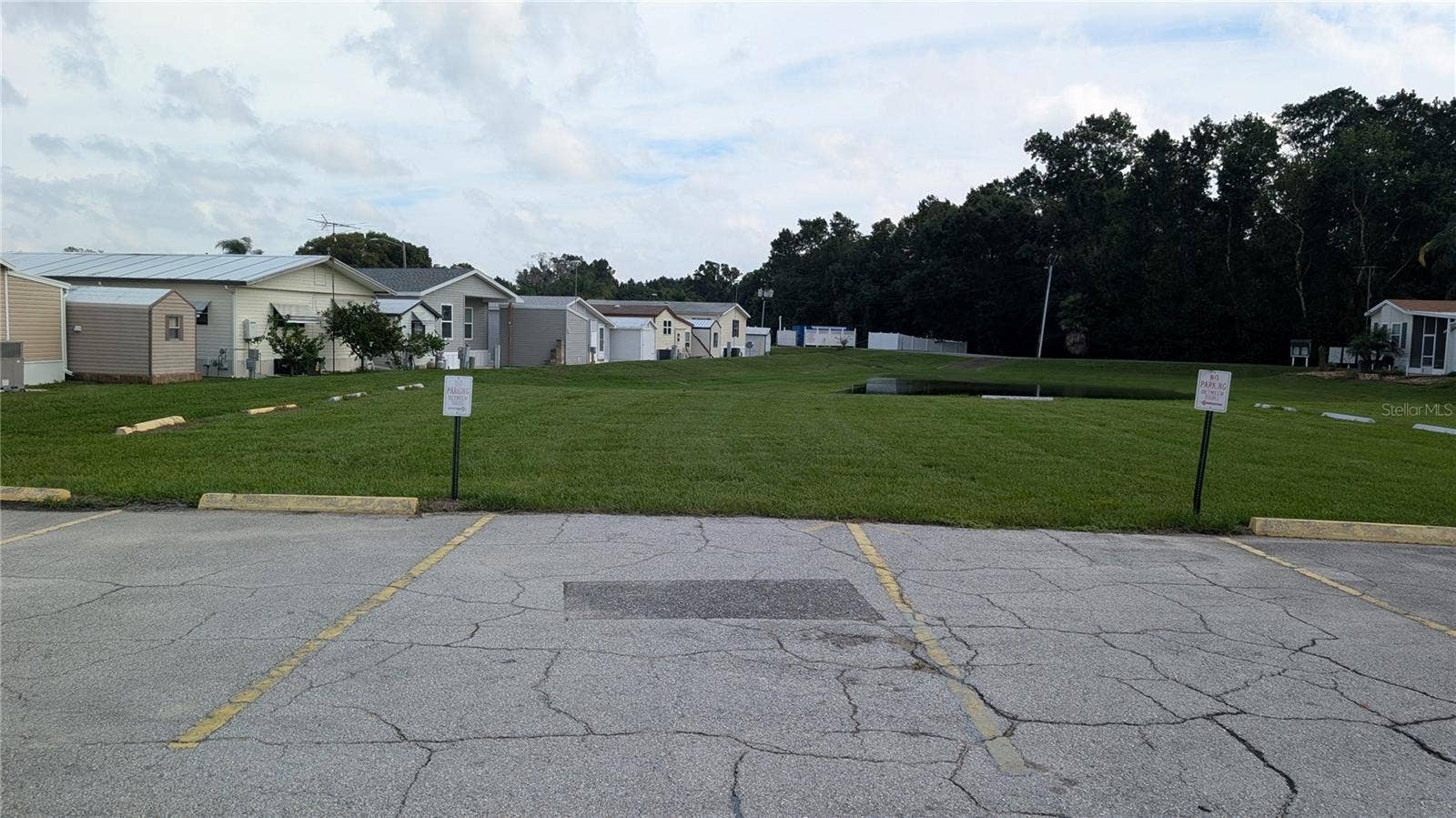 207 CITRUS RIDGE DRIVE, Davenport, FL 33837 OVER LOOKING REAR OF HOUSE (WHITE SHED IN MIDDLE)