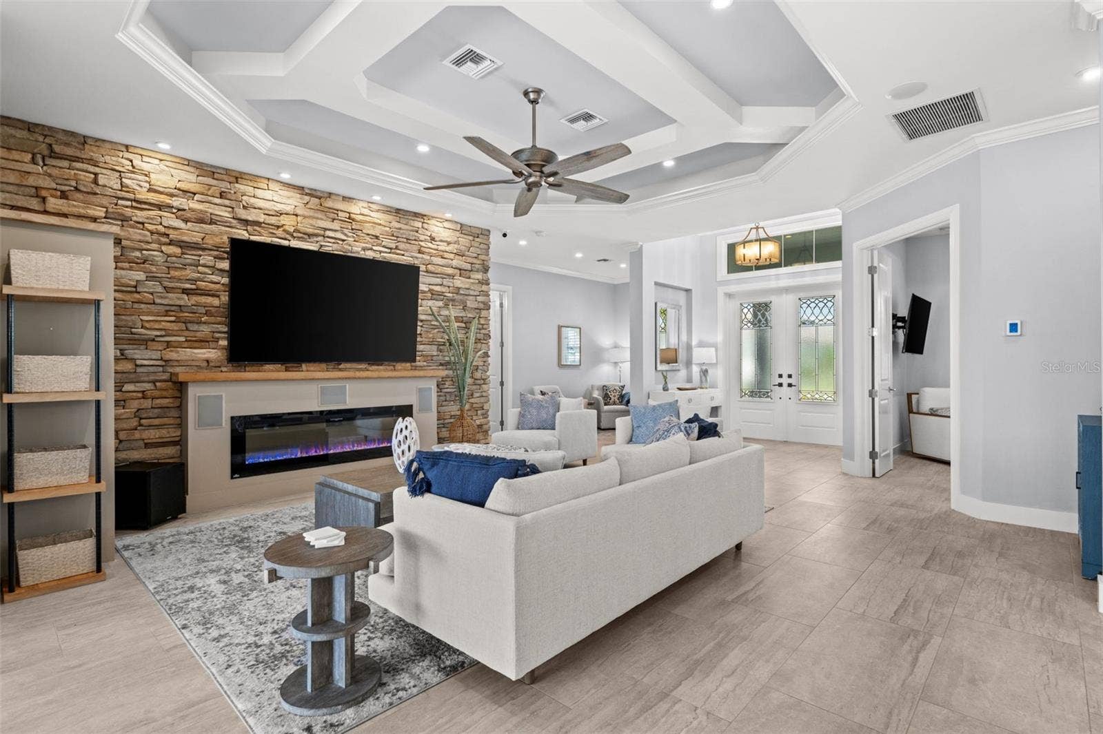 105 SW 52ND STREET, Cape Coral, FL 33914 Accent wall with linear electric fireplace and tv