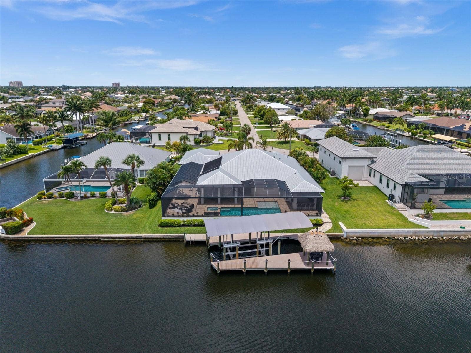 105 SW 52ND STREET, Cape Coral, FL 33914 Aerial view of the dock and covered lift