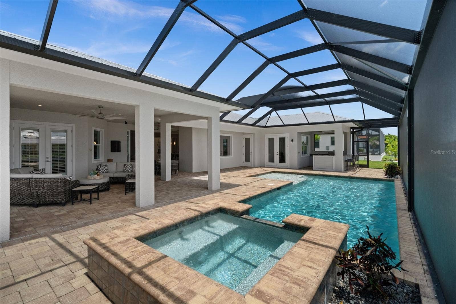 105 SW 52ND STREET, Cape Coral, FL 33914 Large heated saltwater pool, spa, outdoor kitchen, huge lanai and lounging area