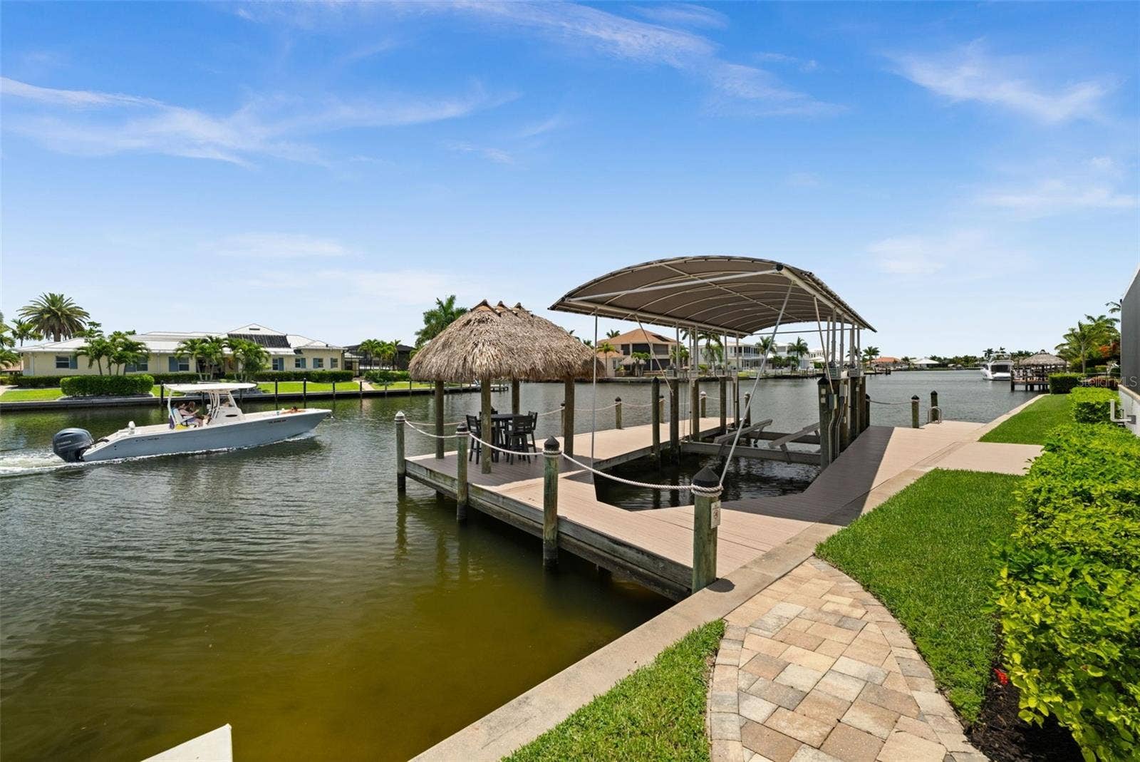 105 SW 52ND STREET, Cape Coral, FL 33914 Dock with tiki and 30,000 lb covered boat lift
