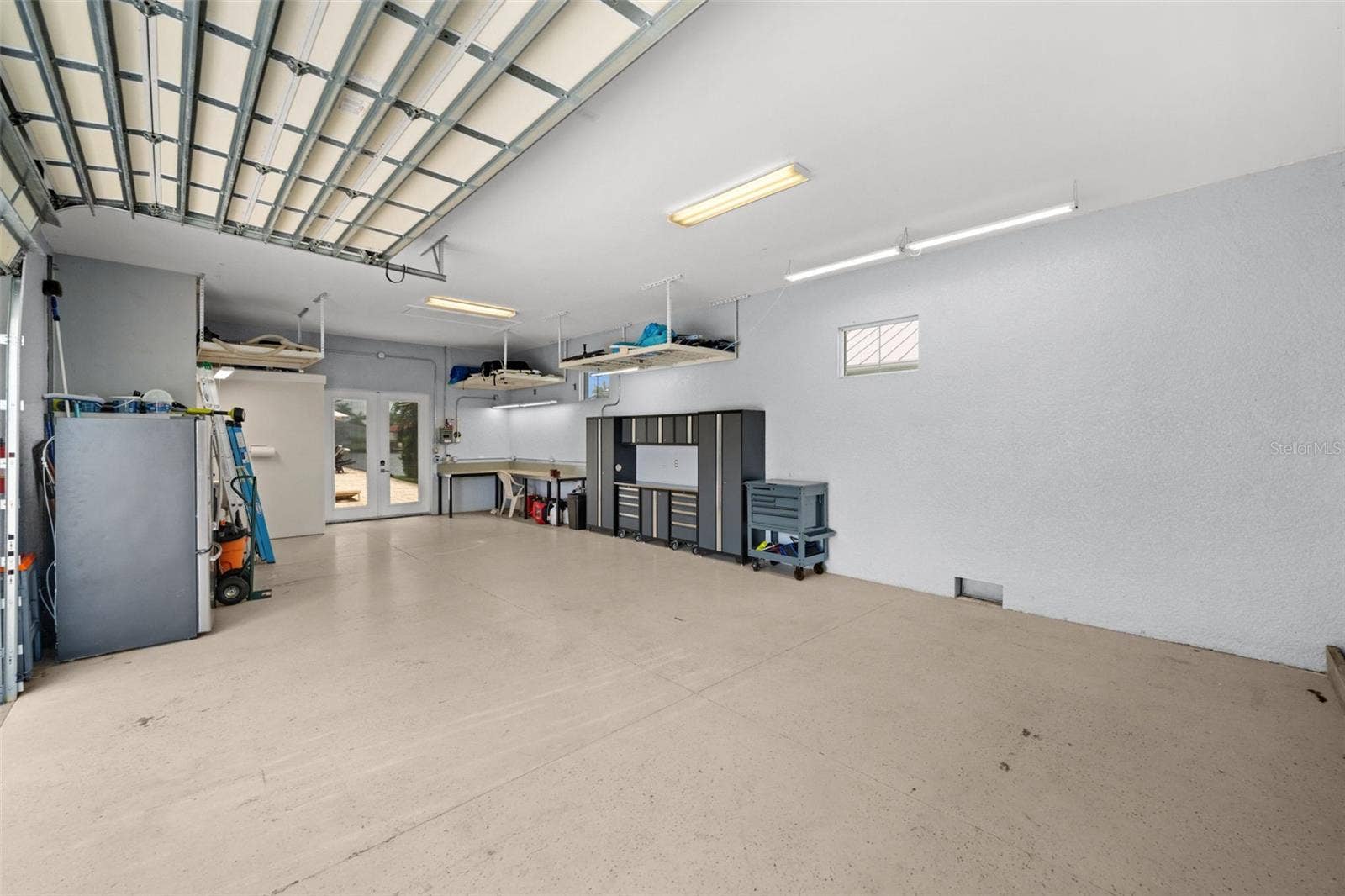 105 SW 52ND STREET, Cape Coral, FL 33914 Soaring ceilings in the mancave give plenty of space to add lifts