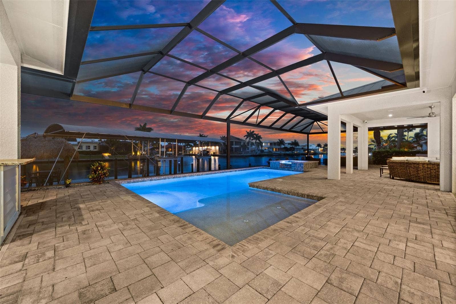 105 SW 52ND STREET, Cape Coral, FL 33914 Great evening views of the pool and canal
