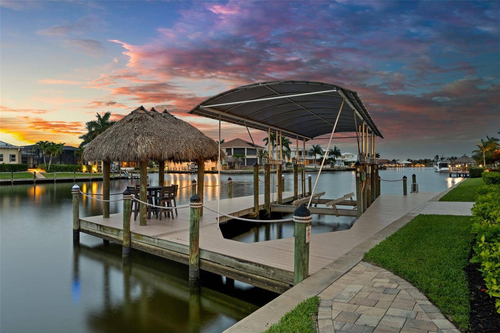 105 SW 52ND STREET, Cape Coral, FL 33914 Dock, lift and canal in the evening
