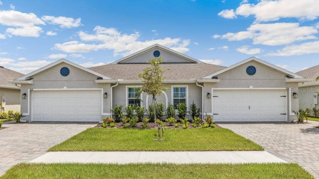 4583 SCHUBERT TRAIL, North Port, FL 34287 Outside of the twin villa Carrington model.