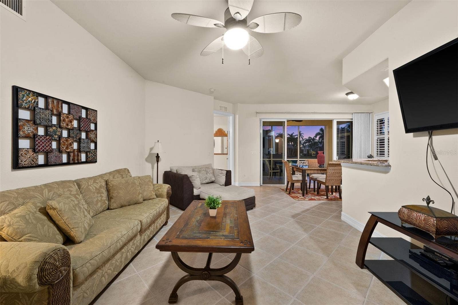 5626 CAPE HARBOUR DRIVE, #102, Cape Coral, FL 33914 Evening View of the Living Room
