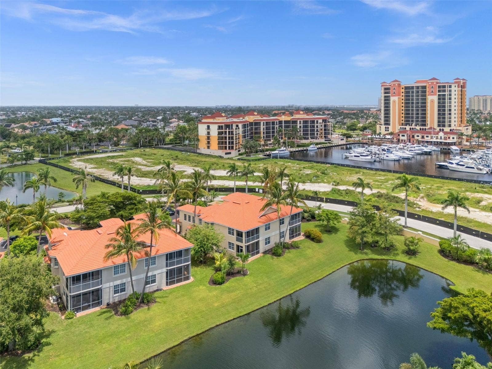 5626 CAPE HARBOUR DRIVE, #102, Cape Coral, FL 33914 Aerial View of the back overlooking Cape Harbour