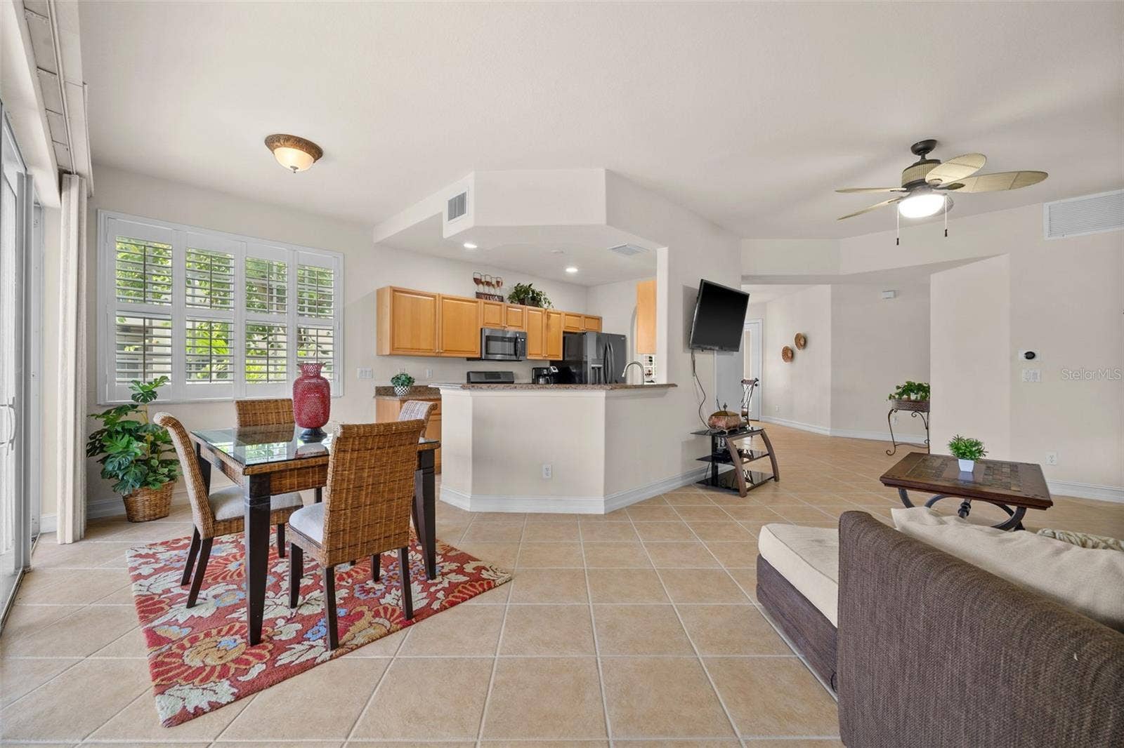 5626 CAPE HARBOUR DRIVE, #102, Cape Coral, FL 33914 Evening View of the Living Room and Kitchen