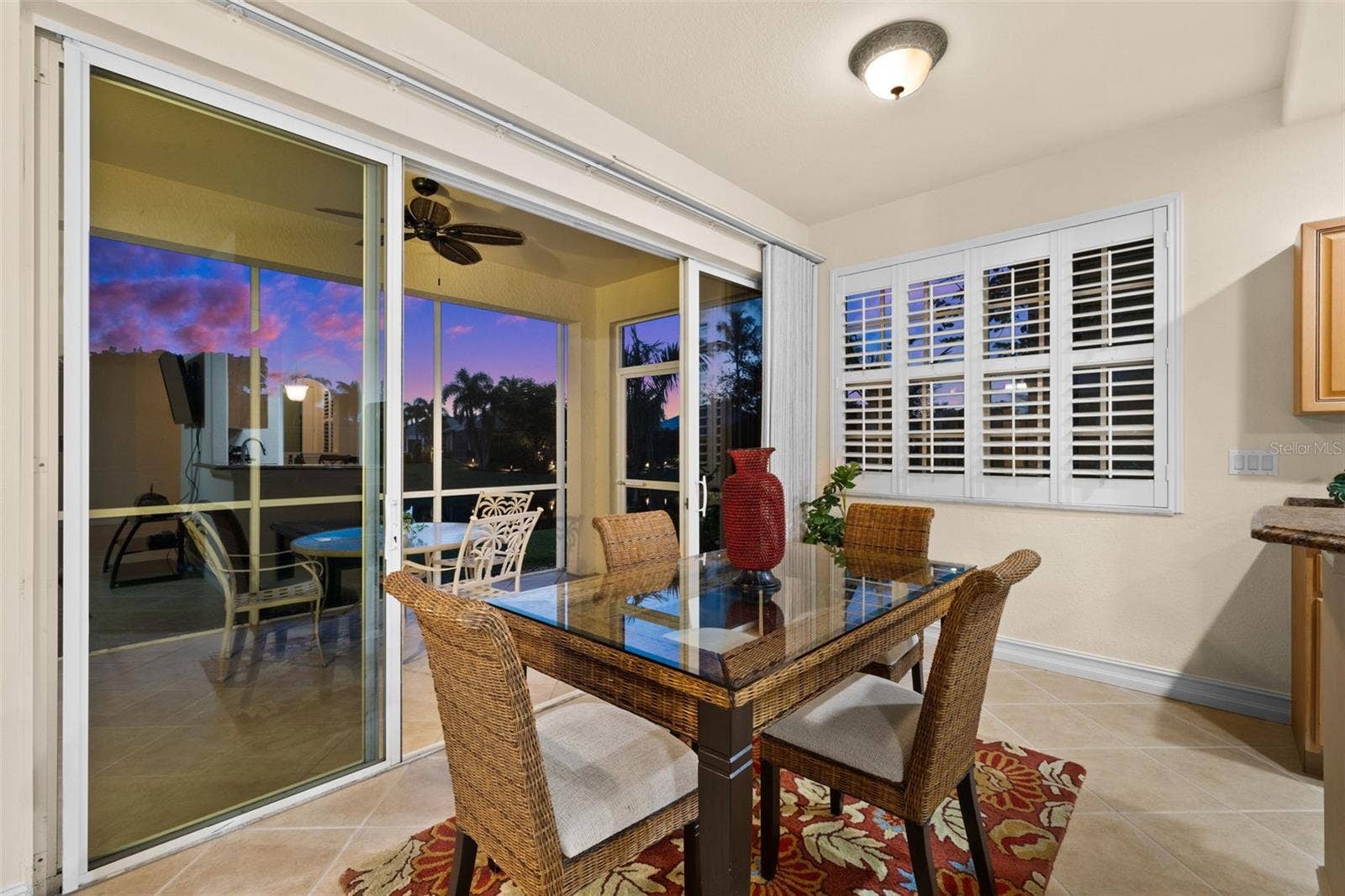 5626 CAPE HARBOUR DRIVE, #102, Cape Coral, FL 33914 Evening View from the Breakfast Area, looking outside