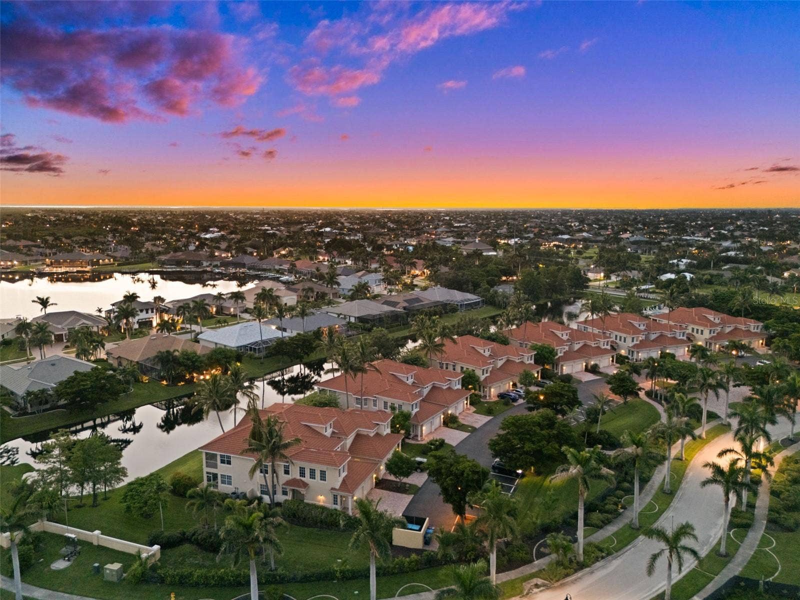 5626 CAPE HARBOUR DRIVE, #102, Cape Coral, FL 33914 Evening View of the Coach Houses