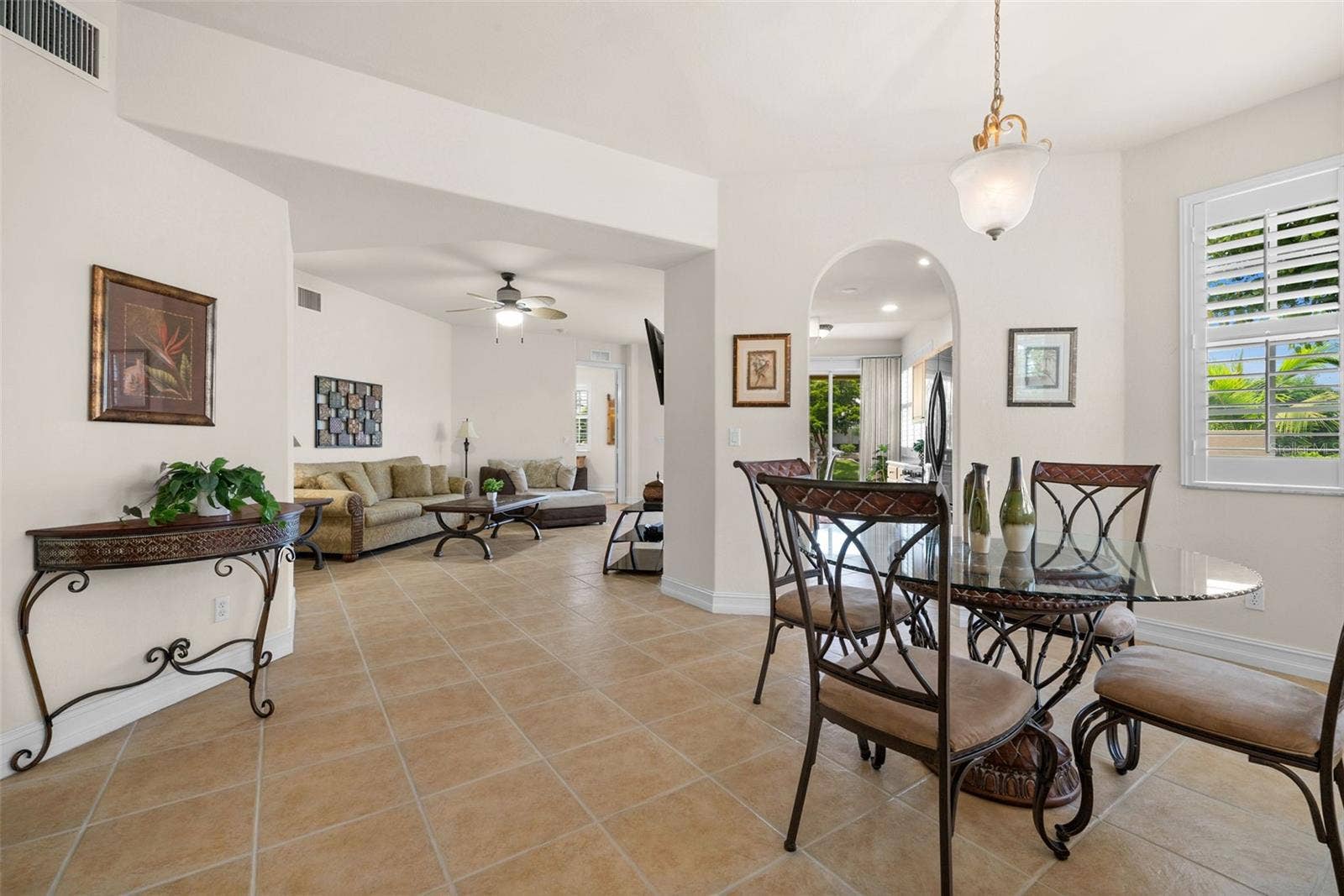 5626 CAPE HARBOUR DRIVE, #102, Cape Coral, FL 33914 Dining Room with Living Room beyond