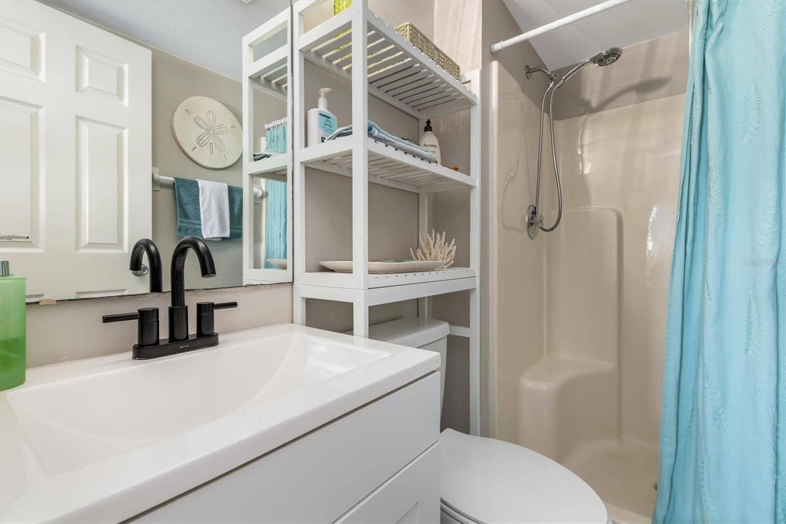 3310 LOVELAND BOULEVARD, #1105, Punta Gorda, FL 33980 PRIMARY WALK IN SHOWER SOLID SURFACE COUNTER.