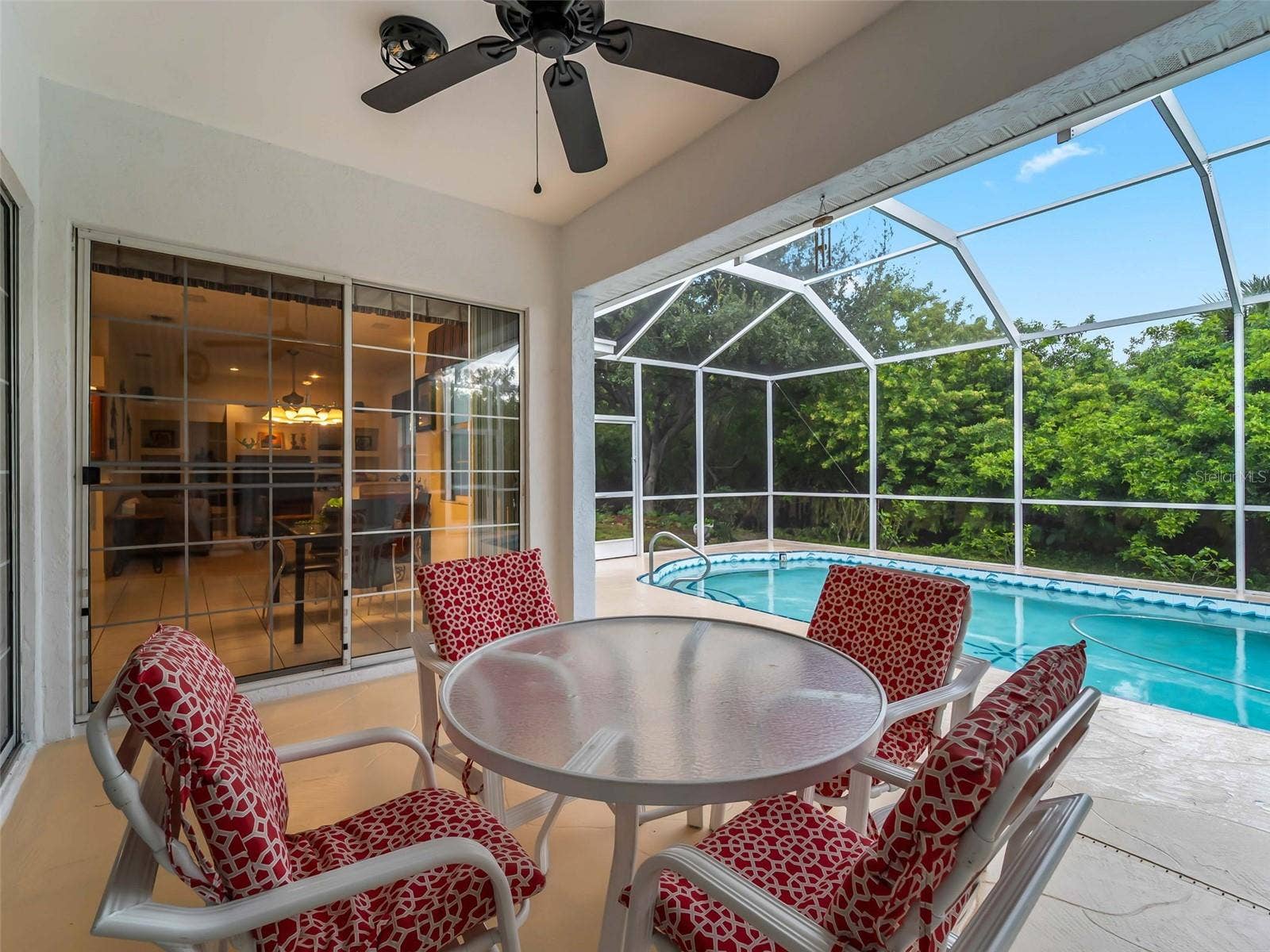 ScreenedLanai_9336StPaulDr_PortCharlotte_OutdoorDining_Corner.jpg