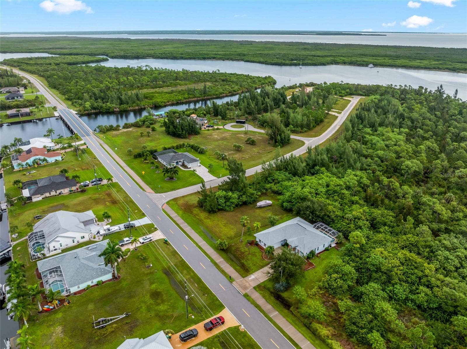 Aerial_9336StPaulDr_PortCharlotte_WaterProximity_Panorama.jpg