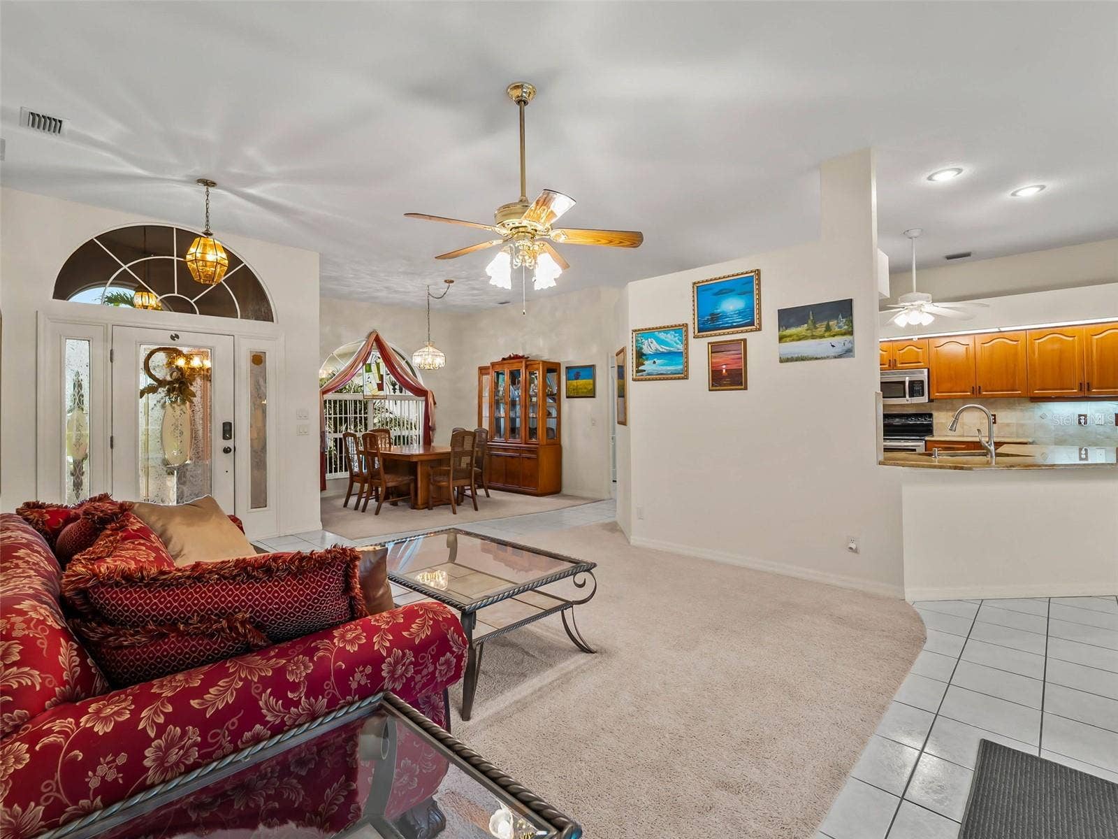 LivingDining_9336StPaulDr_PortCharlotte_OpenConcept_Panorama.jpg