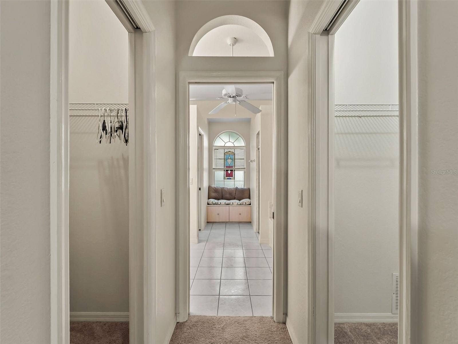 PrimaryBath_9336StPaulDr_PortCharlotte_ArchedWindow_Entry.jpg