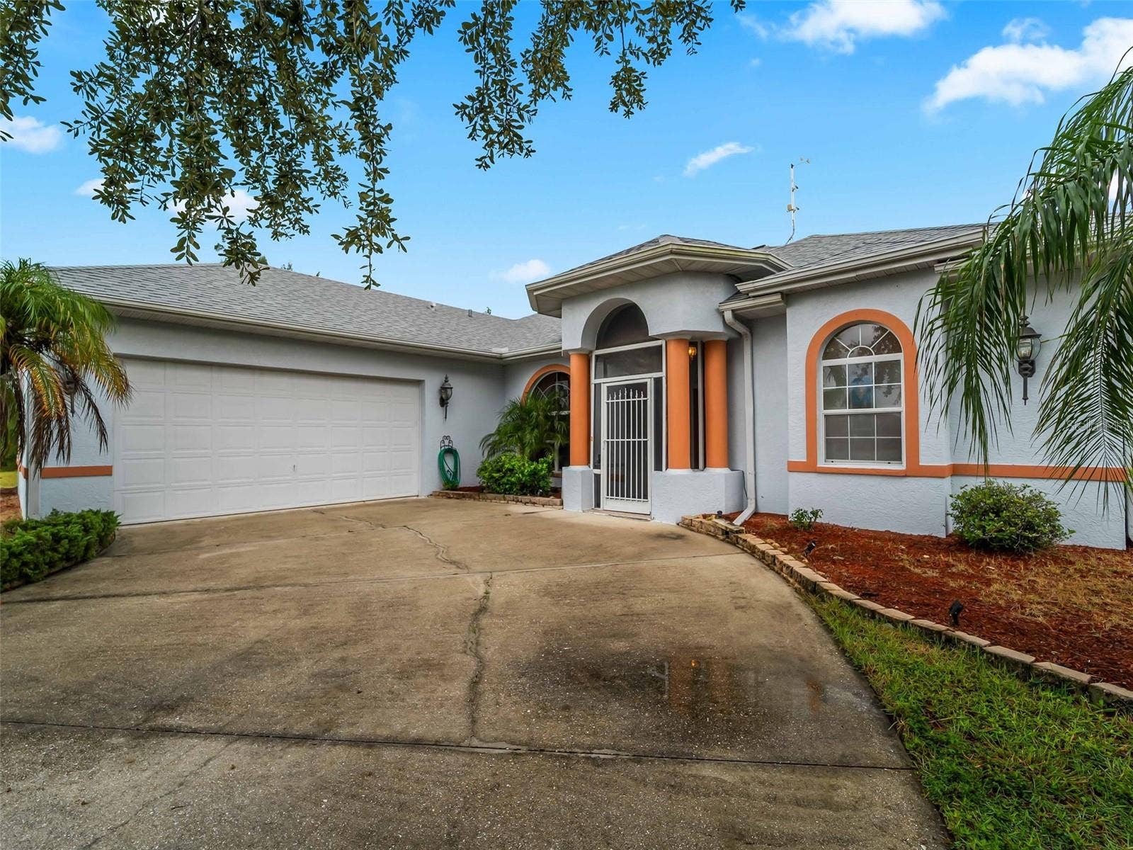 FrontExterior_9336StPaulDr_PortCharlotte_Driveway_Corner.jpg