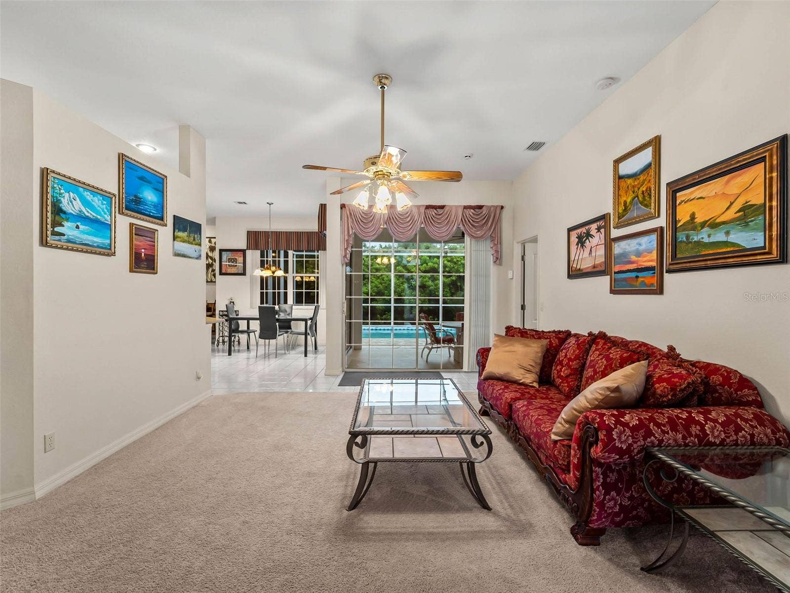 LivingRoom_9336StPaulDr_PortCharlotte_PoolAccess_SliderView.jpg