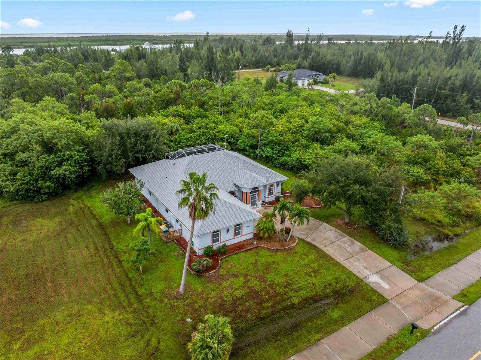 Aerial_9336StPaulDr_PortCharlotte_PrivateLot_Corner.jpg
