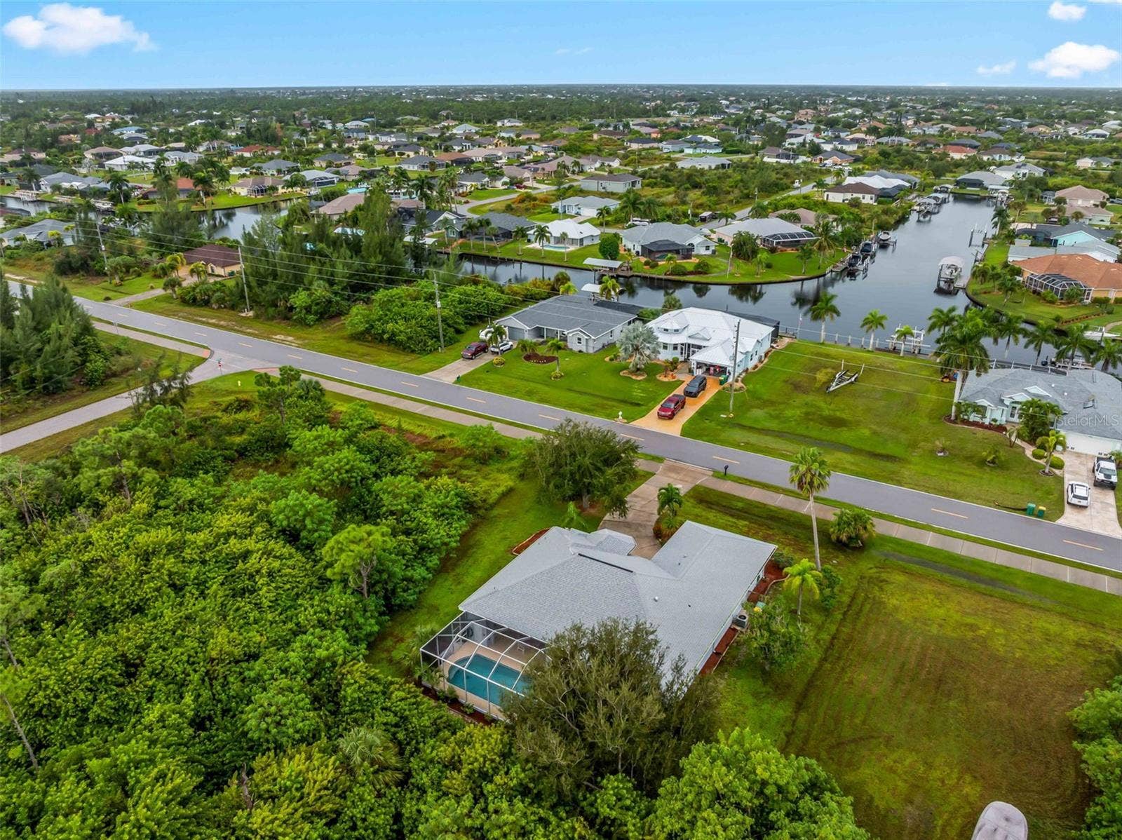 Aerial_9336StPaulDr_PortCharlotte_PoolHome_Panorama.jpg