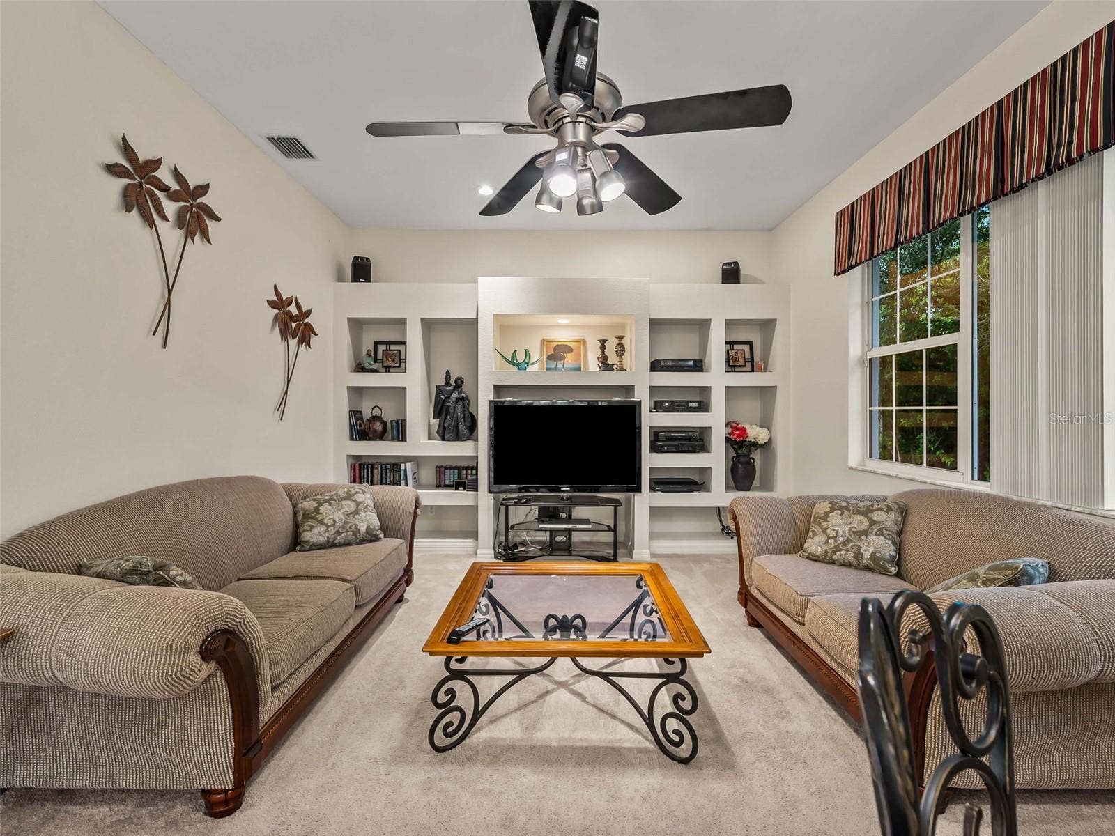 FamilyRoom_9336StPaulDr_PortCharlotte_BuiltInEntertainment_Wide.jpg
