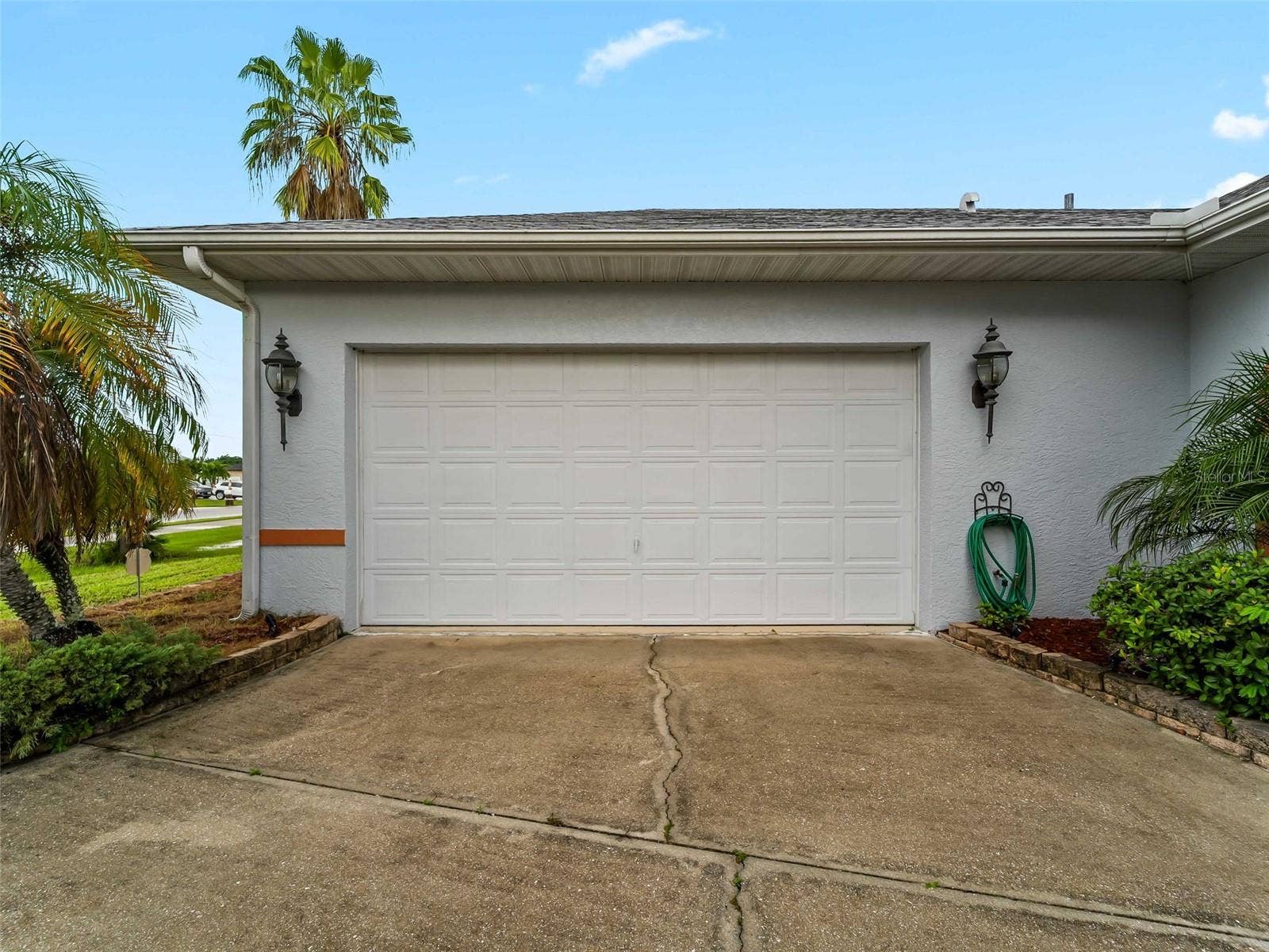 Garage_9336StPaulDr_PortCharlotte_Driveway_Wide.jpg