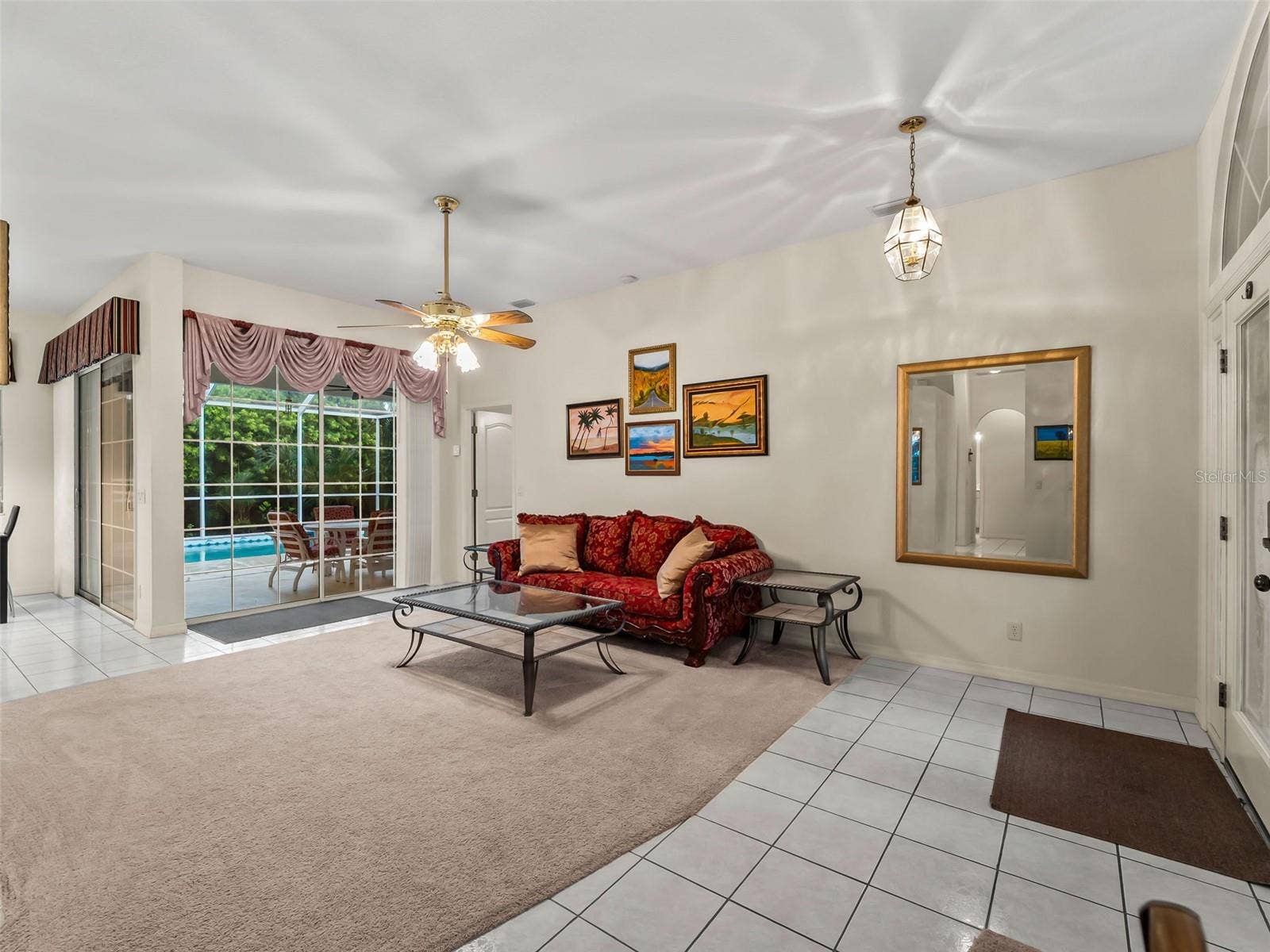 LivingRoom_9336StPaulDr_PortCharlotte_PoolView_Wide.jpg