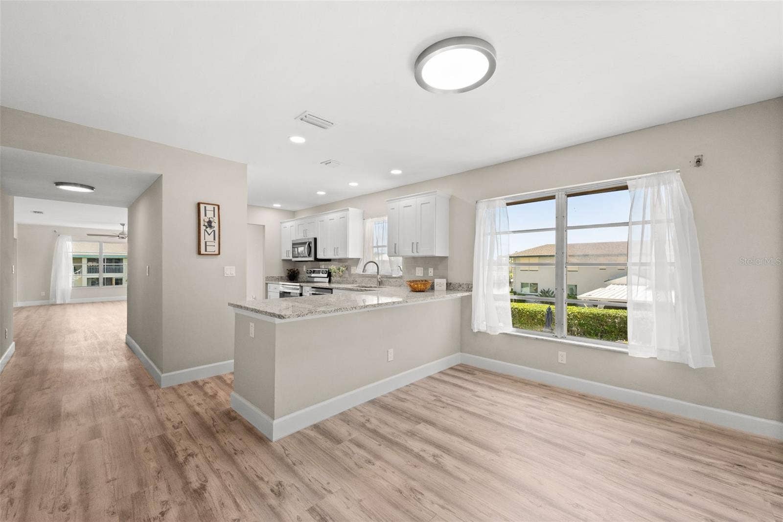 1345 SE 40TH TERRACE, #2E, Cape Coral, FL 33904 Looking from the breakfast nook to kitchen and living