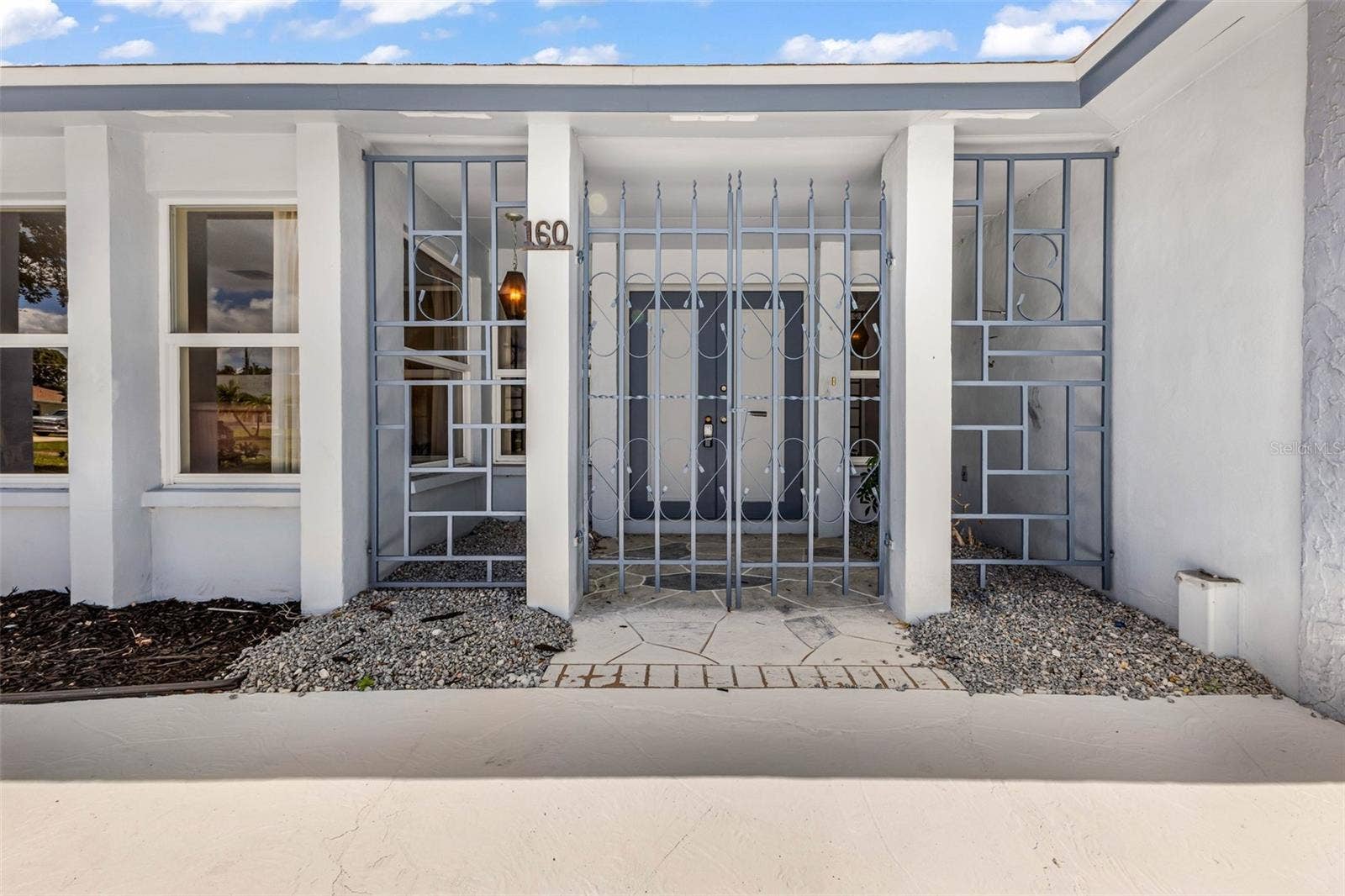 160 ANNAPOLIS LANE, Rotonda West, FL 33947 Private gated entry way to your courtyard and double entry doorway.