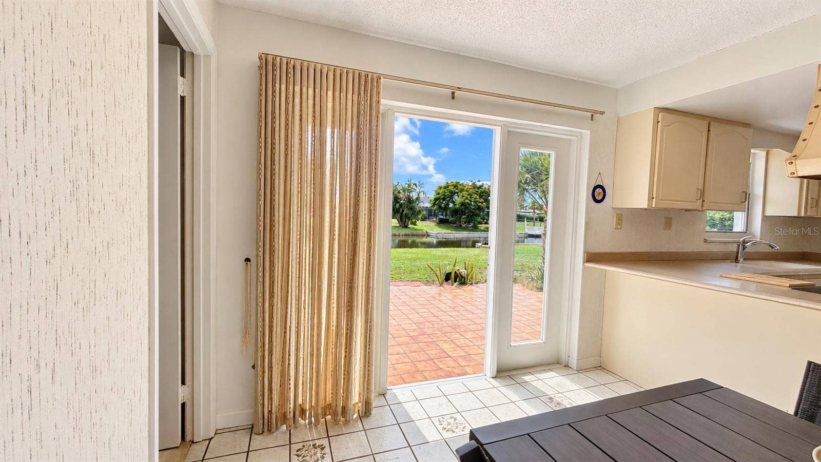 160 ANNAPOLIS LANE, Rotonda West, FL 33947 Dining and kitchen views of the waterfront.