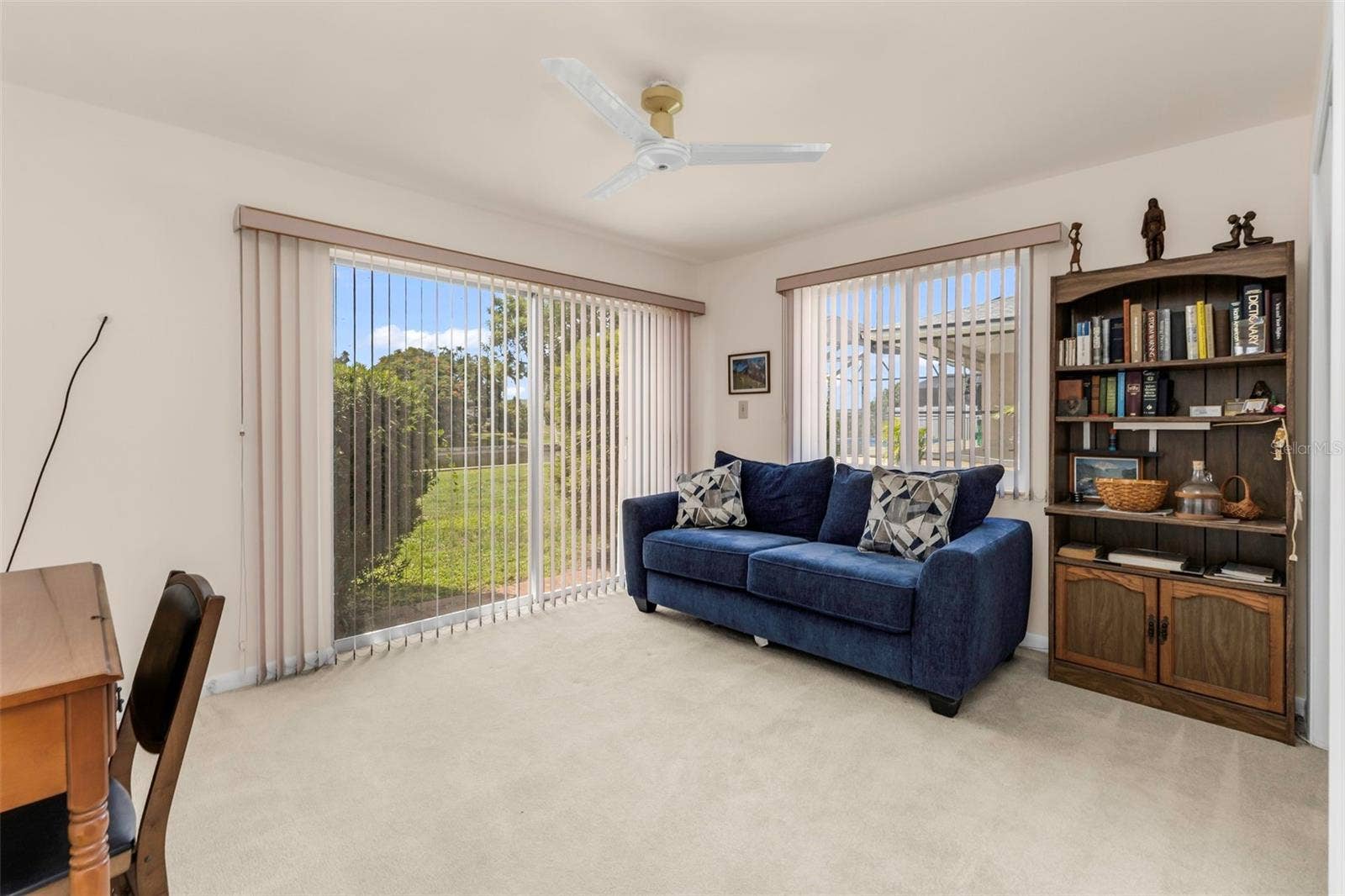 160 ANNAPOLIS LANE, Rotonda West, FL 33947 Bedroom 3 (or Den/Office) with Sliders to outside and large closet, windows, and ceiling fan.